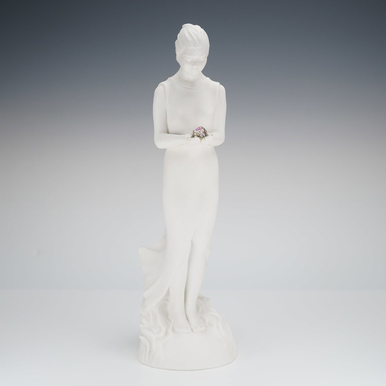 Royal Doulton Discovery Figurine HN3428: A single Royal Doulton porcelain figurine titled "Discovery," model number HN3428. The piece is executed in matte white biscuit porcelain, depicting a standing female figure in a flowing, windswept go