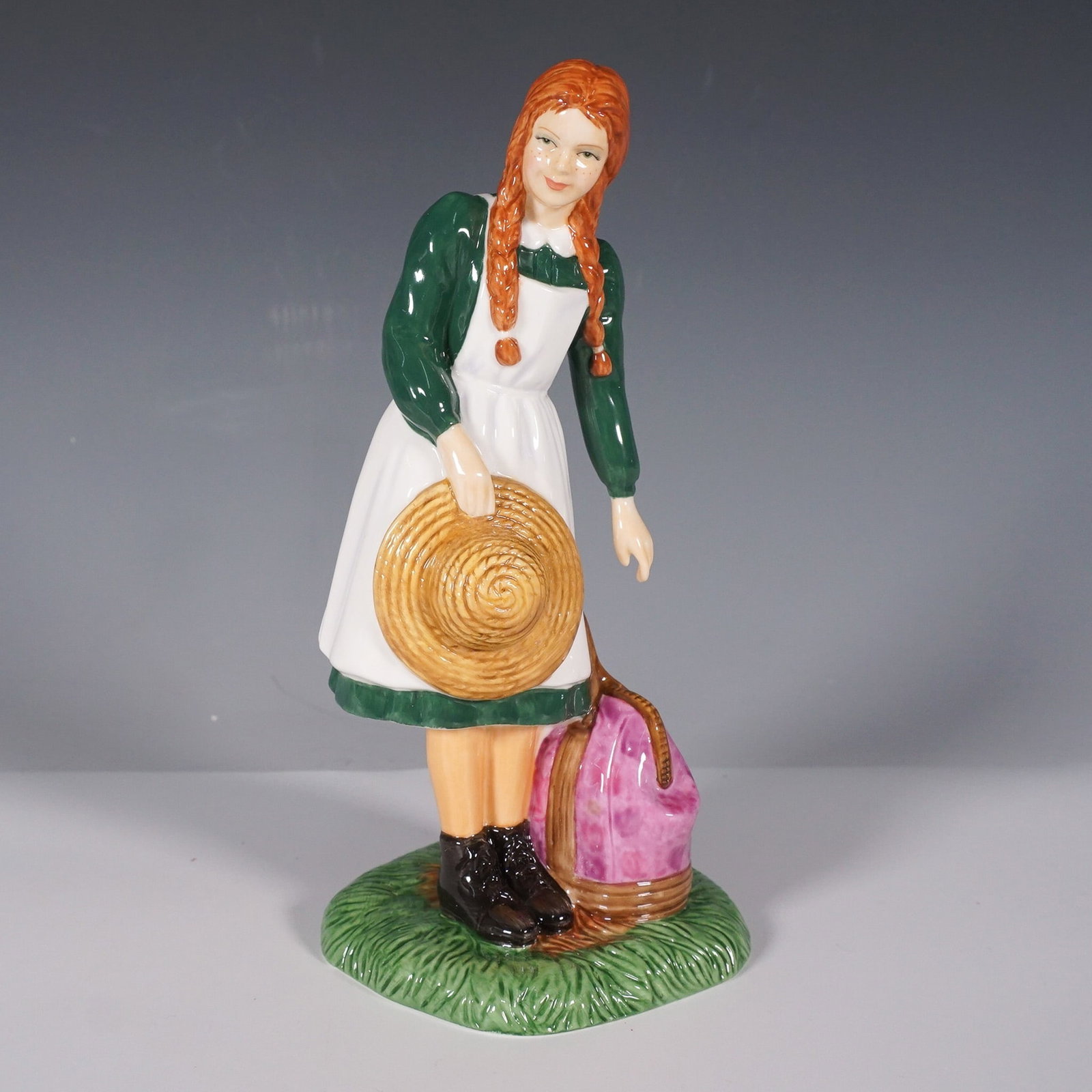 Royal Doulton Figurine, Anne Arrives at Green Gables HN5225: This Royal Doulton figurine is part of the Anne of Green Gables series and celebrates the iconic literary character's arrival at Green Gables. Designed by Nada Pedley, this limited edition figurine is