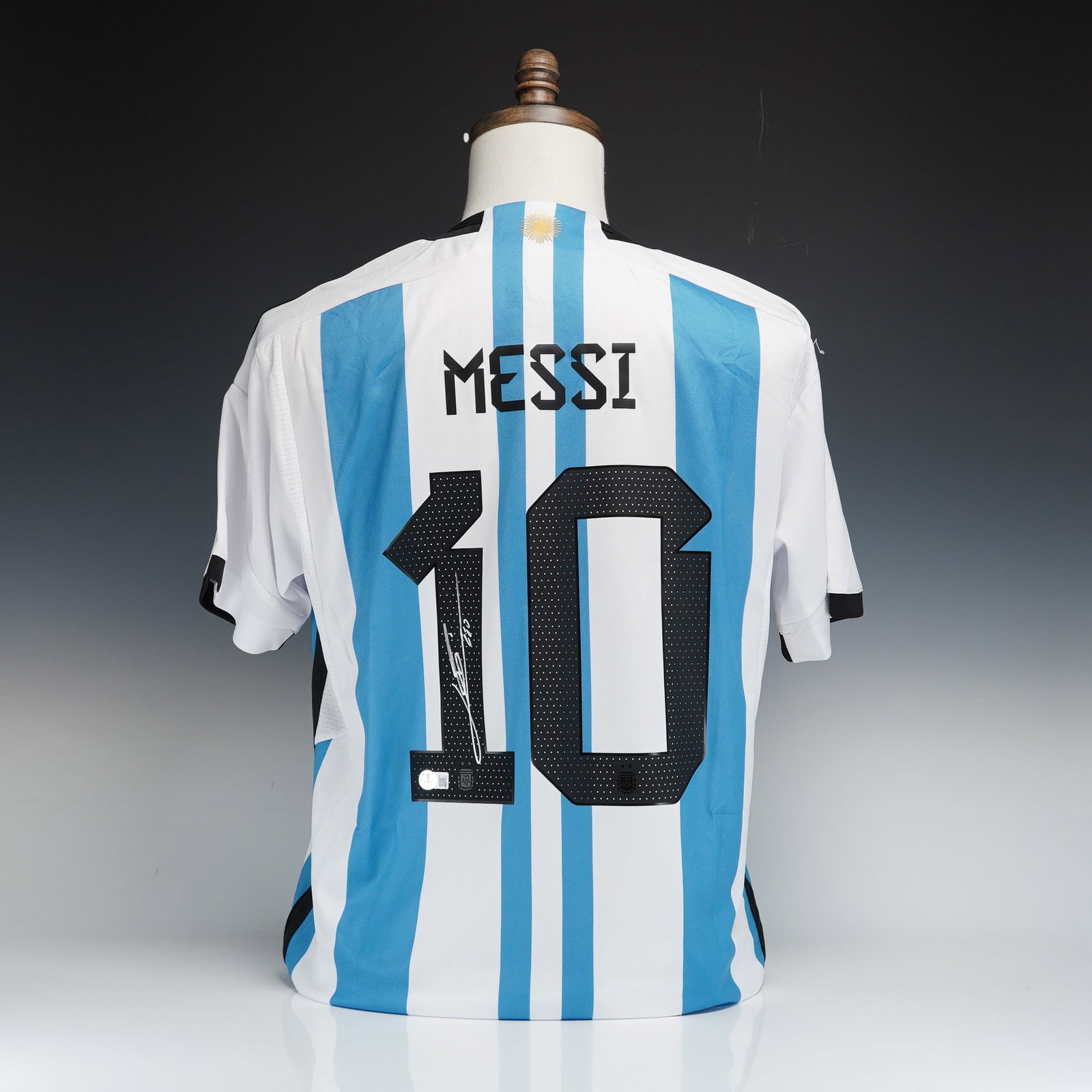 Signed Lionel Messi Argentina National Team Adidas Home Jersey with Authentication: This Argentina national team home jersey is manufactured by Adidas and features the team's signature light blue and white vertical stripes. This sports memorabilia item represents the style worn durin