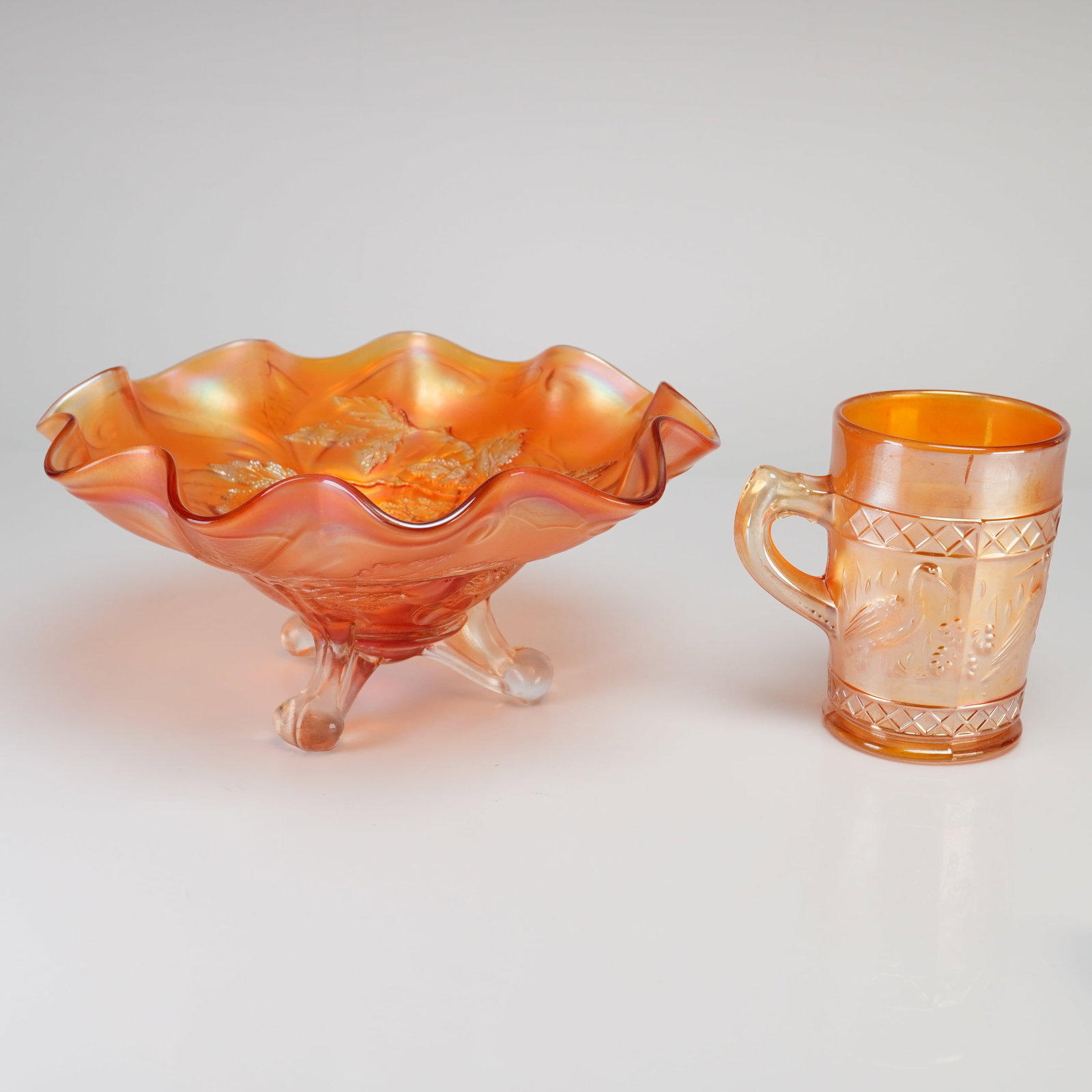 Two Pieces of Marigold Carnival Glass Including a Footed Bowl and a Mug (1 of 3)