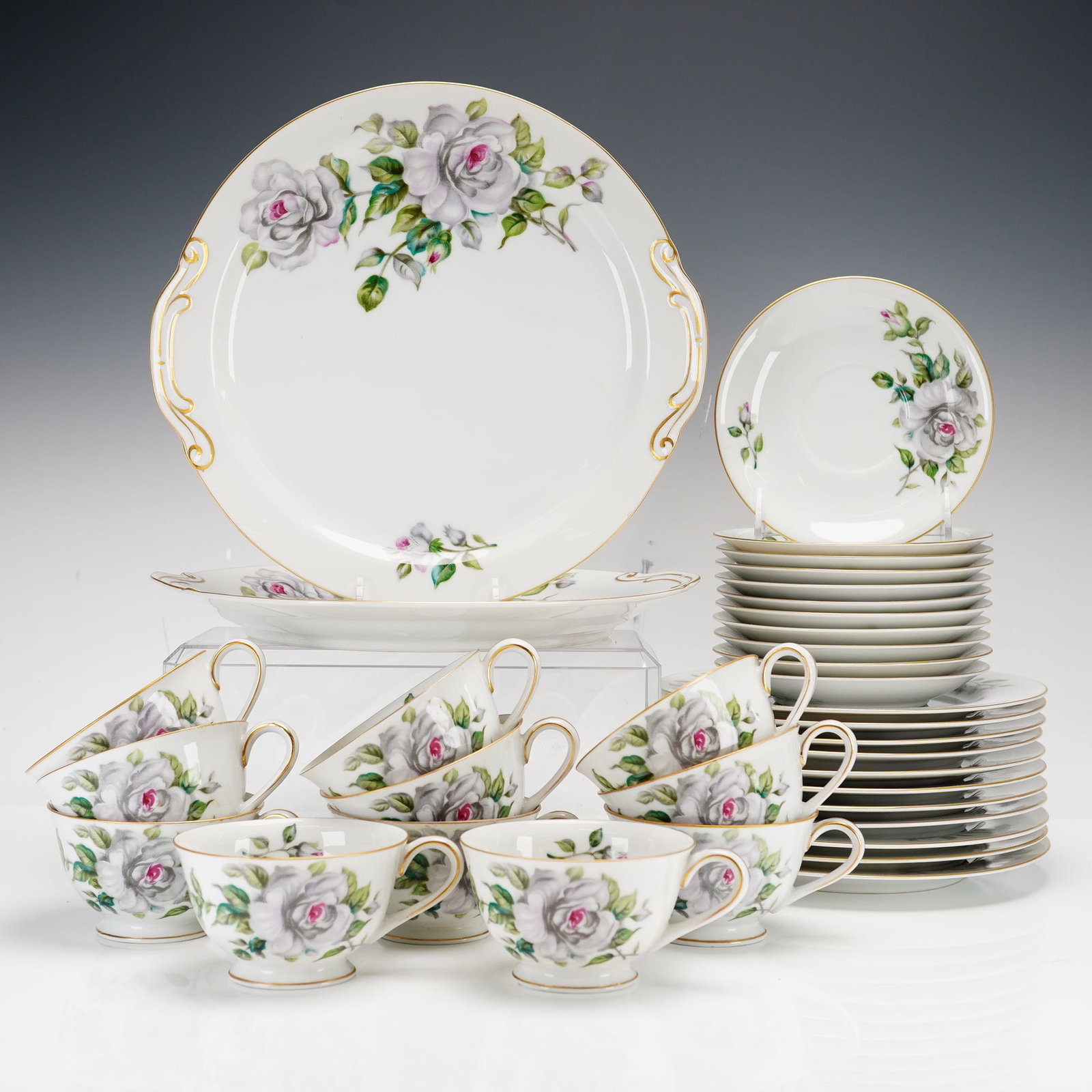35pc Made in Japan Craftsman China Porcelain Dessert Set: This 35-piece set was manufactured in Japan by Craftsman China. The service is constructed of fine white porcelain decorated in pattern number 398, which features gray and white roses with pink center