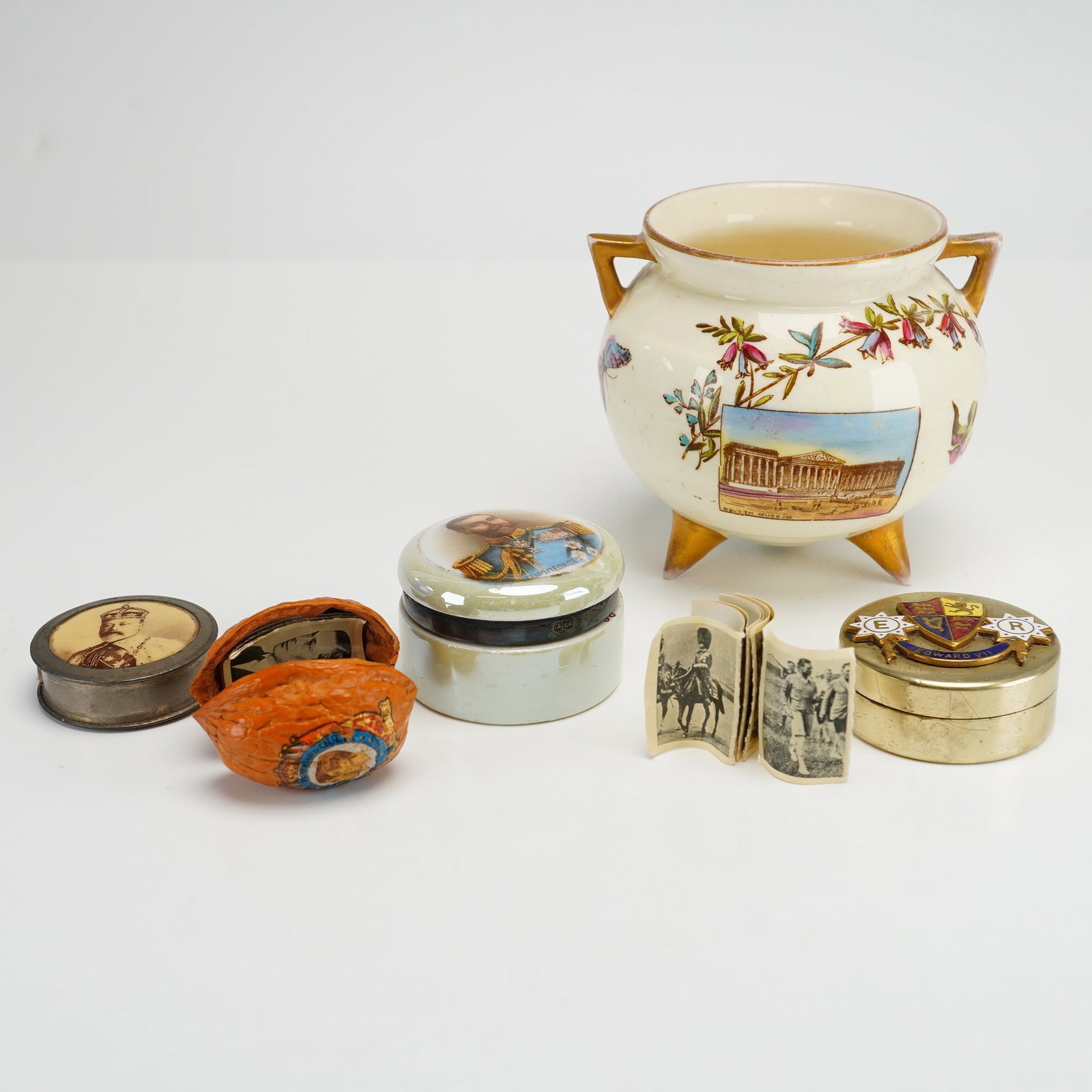 Collection of English Items Including Small Footed Bowl and Souvenirs: This collection of English small items includes one vintage small footed bowl and four other souvenirs. The lot features a circular metal advertising measuring tape for the Madame paper with a sepia-t