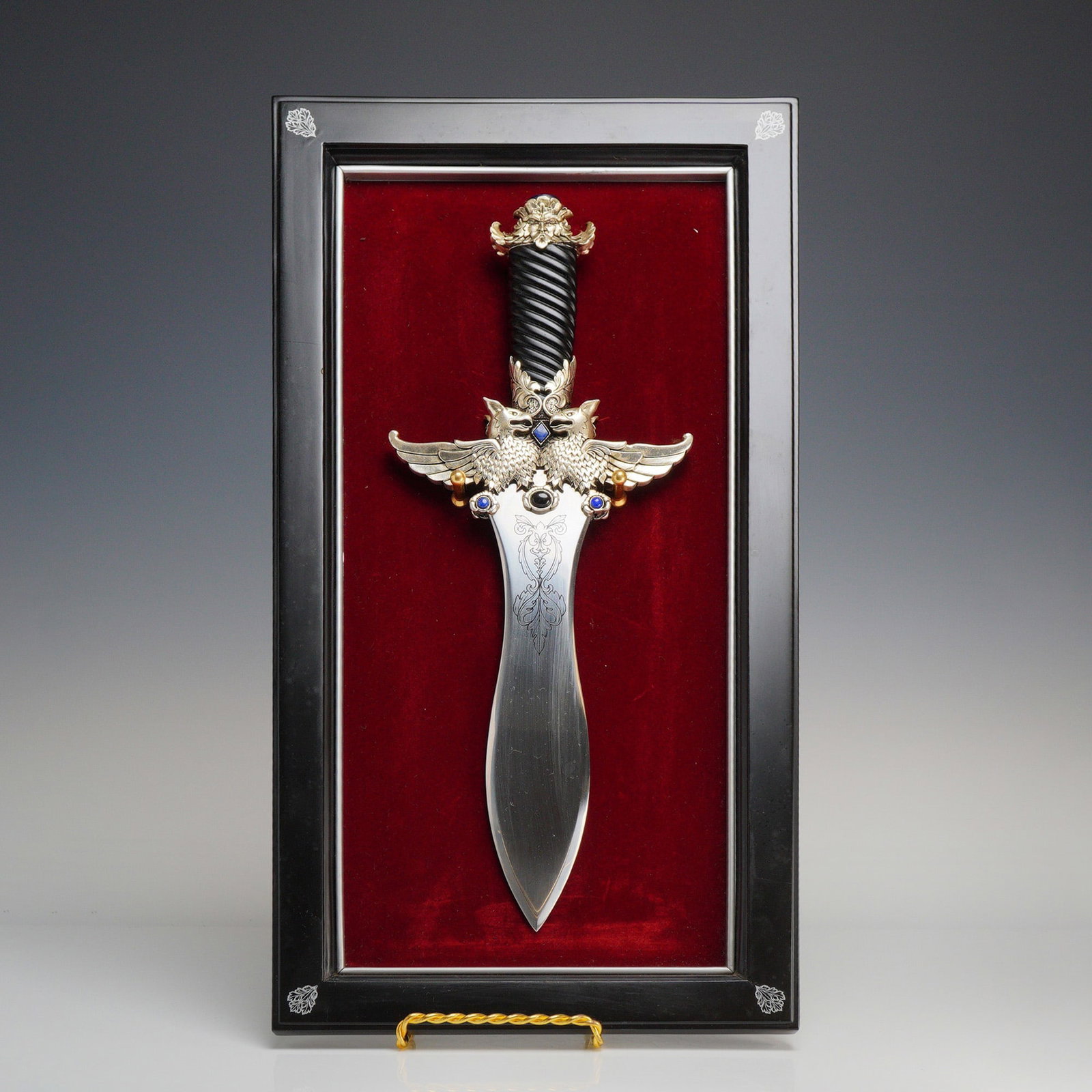 Contemporary Fantasy, Decorative Dagger, The Treasure of the Griffin Dagger by Greg Hildebrandt for: A contemporary decorative fantasy piece titled The Treasure of the Griffin Dagger, designed by renowned fantasy artist Greg Hildebrandt for the Franklin Mint. This display item features a leaf-shaped,