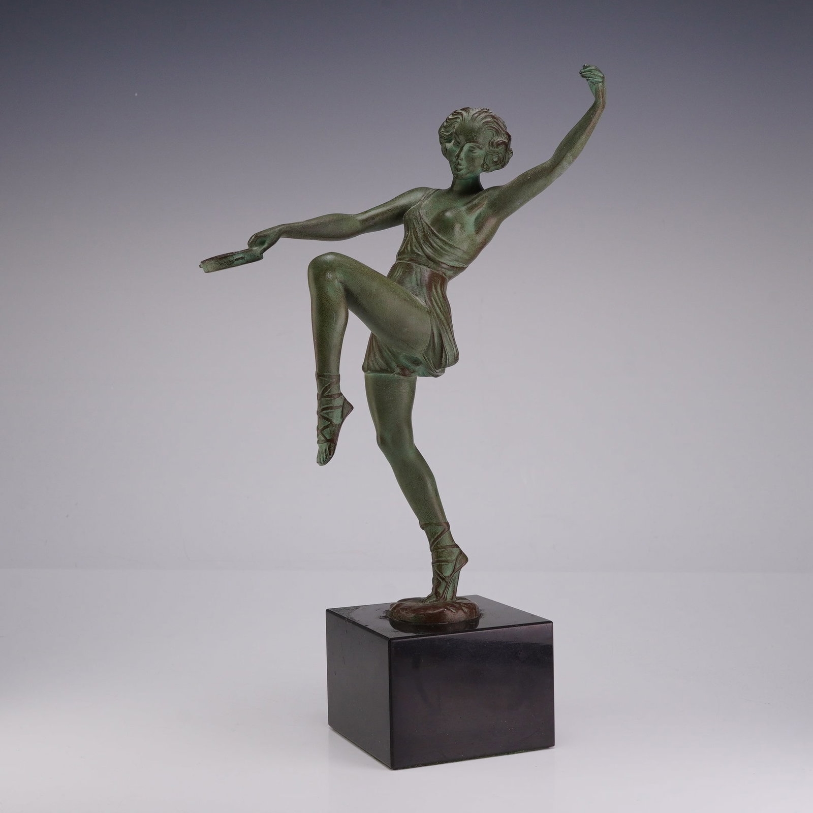 Pierre Le Faguays (French, 1892-1962) Art Deco Bronze Sculpture, Tambourine Dancer, Signed: This Art Deco bronze sculpture by French sculptor Pierre Le Faguays (Fayral) is titled Tambourine Dance. It depicts a female dancer in a dynamic, one-legged pose with her arms outstretched, holding a 
