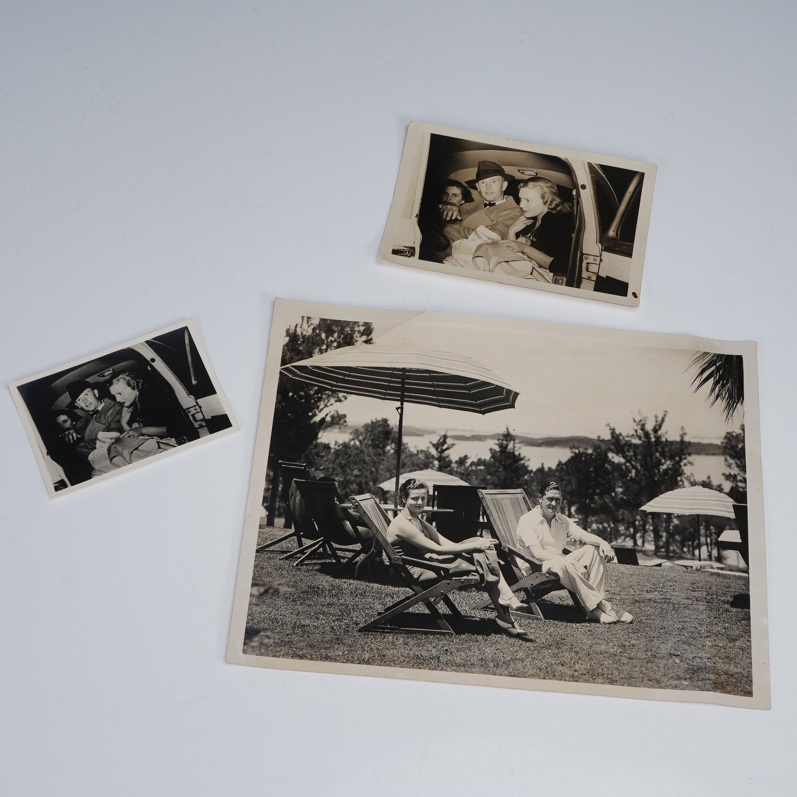 3pc Vintage Black and White Portrait Photos: Collection features a 1933 press photo copy of Prince and Princess Rospigliosi during their stay at the Belmont Hotel in Bermuda, depicting the couple seated outdoors in lounge chairs with parasols an