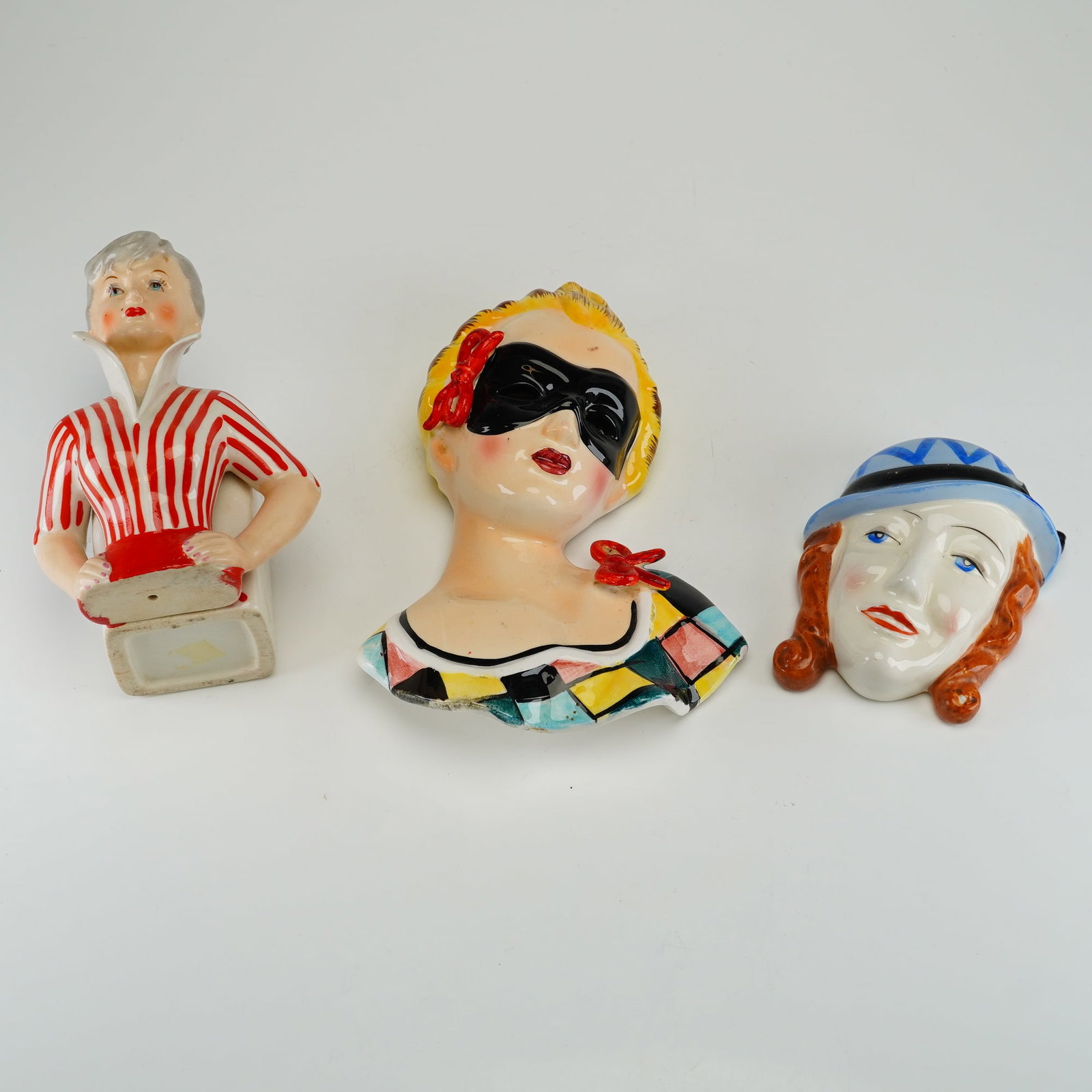 3pc Mid-Century Ceramic Lady Head Wall Pockets and Planter: This collection of mid-century glazed ceramic decorative items consists of three figural pieces. The first item is a lady head planter depicting a woman with short silver-blonde hair and red lips, wea