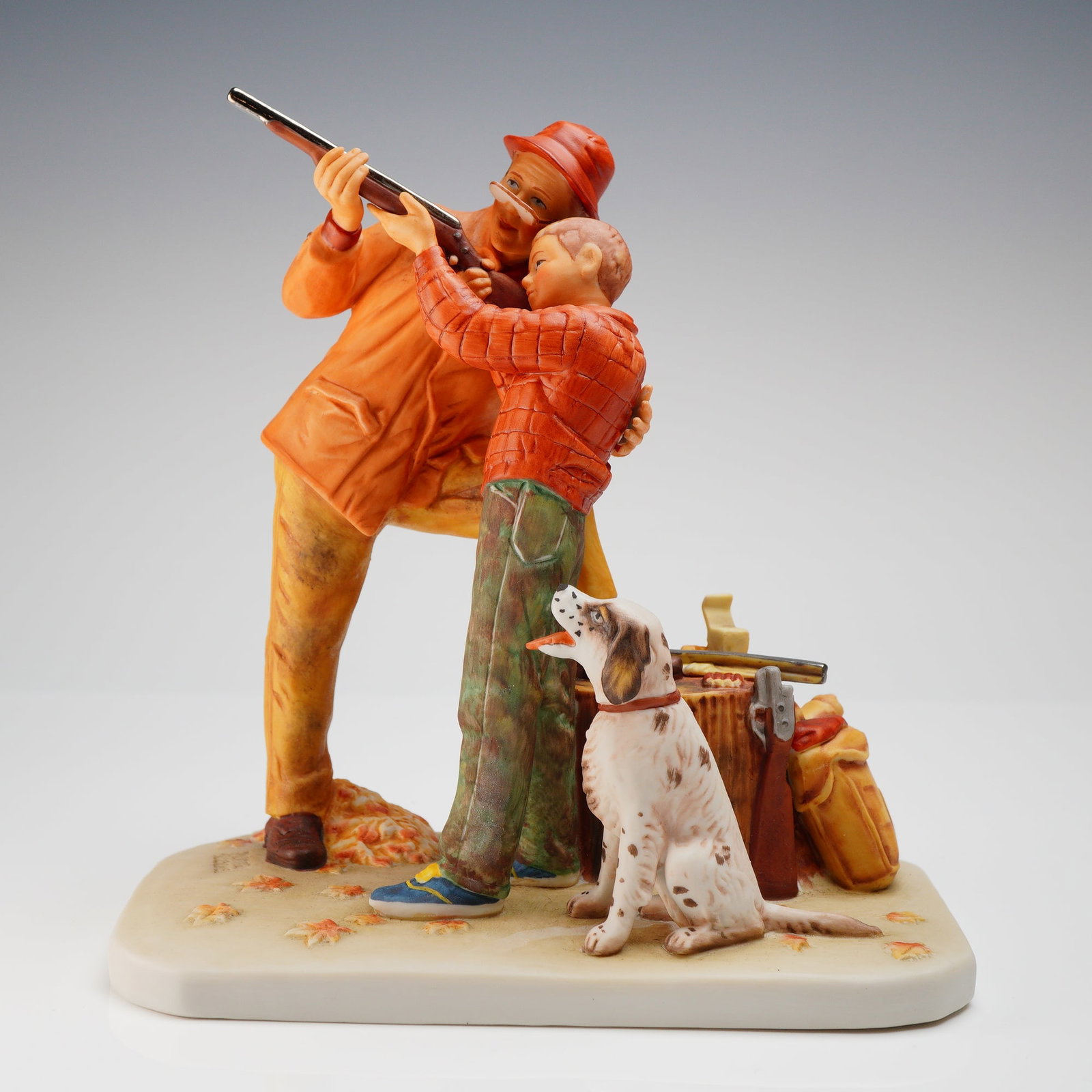 Gorham Norman Rockwell Fall Careful Aim Figurine: A single painted ceramic figurine manufactured by Gorham, titled Fall Careful Aim. This piece is part of the Four Seasons Illustrations for 1961 First Edition series inspired by the work of Norman Roc