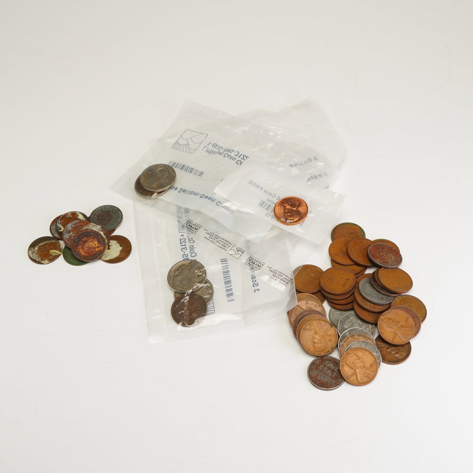 A Collection of US Coins Including Three Littleton Coin Co. Sets, Indian Head Cents, and Lincoln (1 of 3)