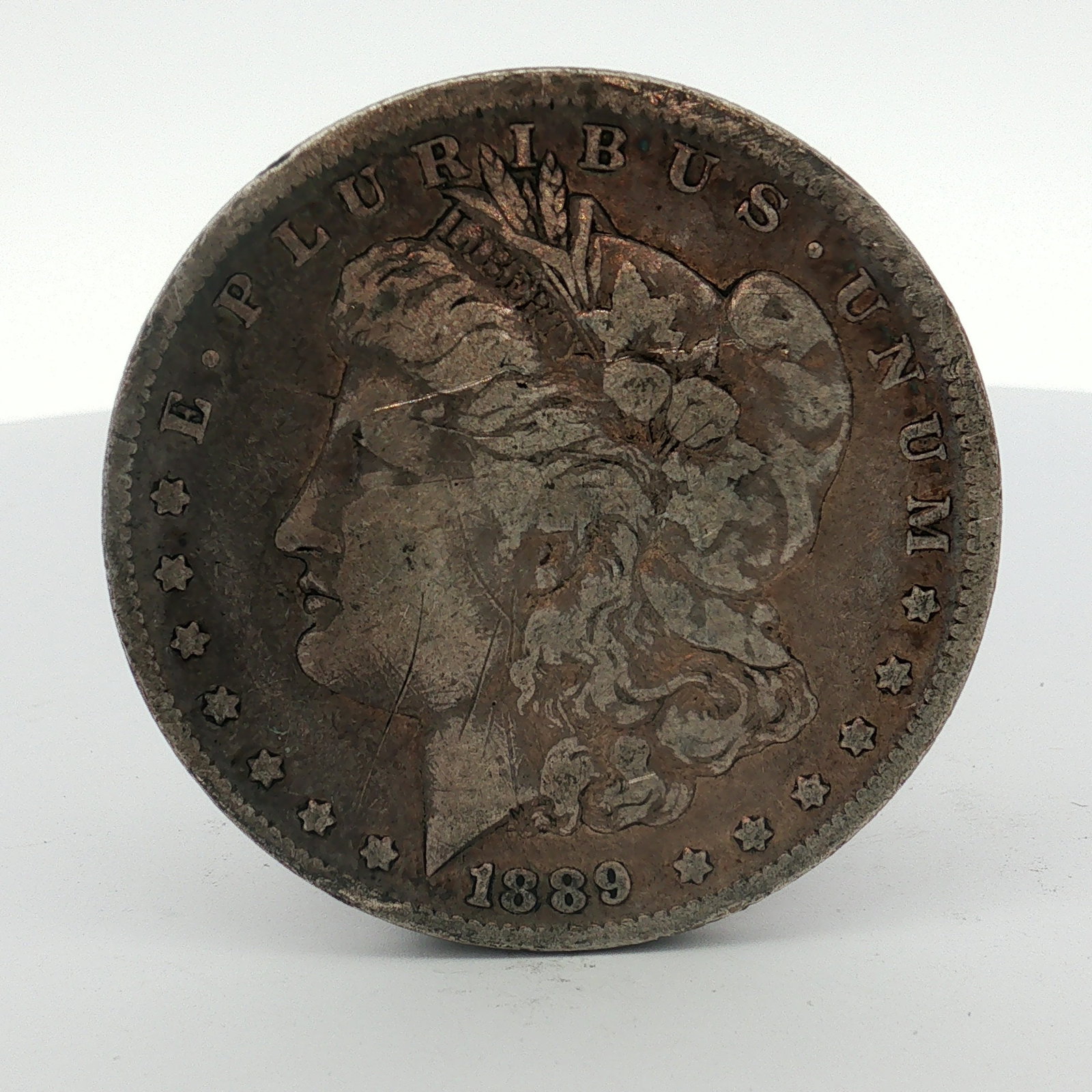 1889-O US Morgan Silver Dollar (1 of 2)
