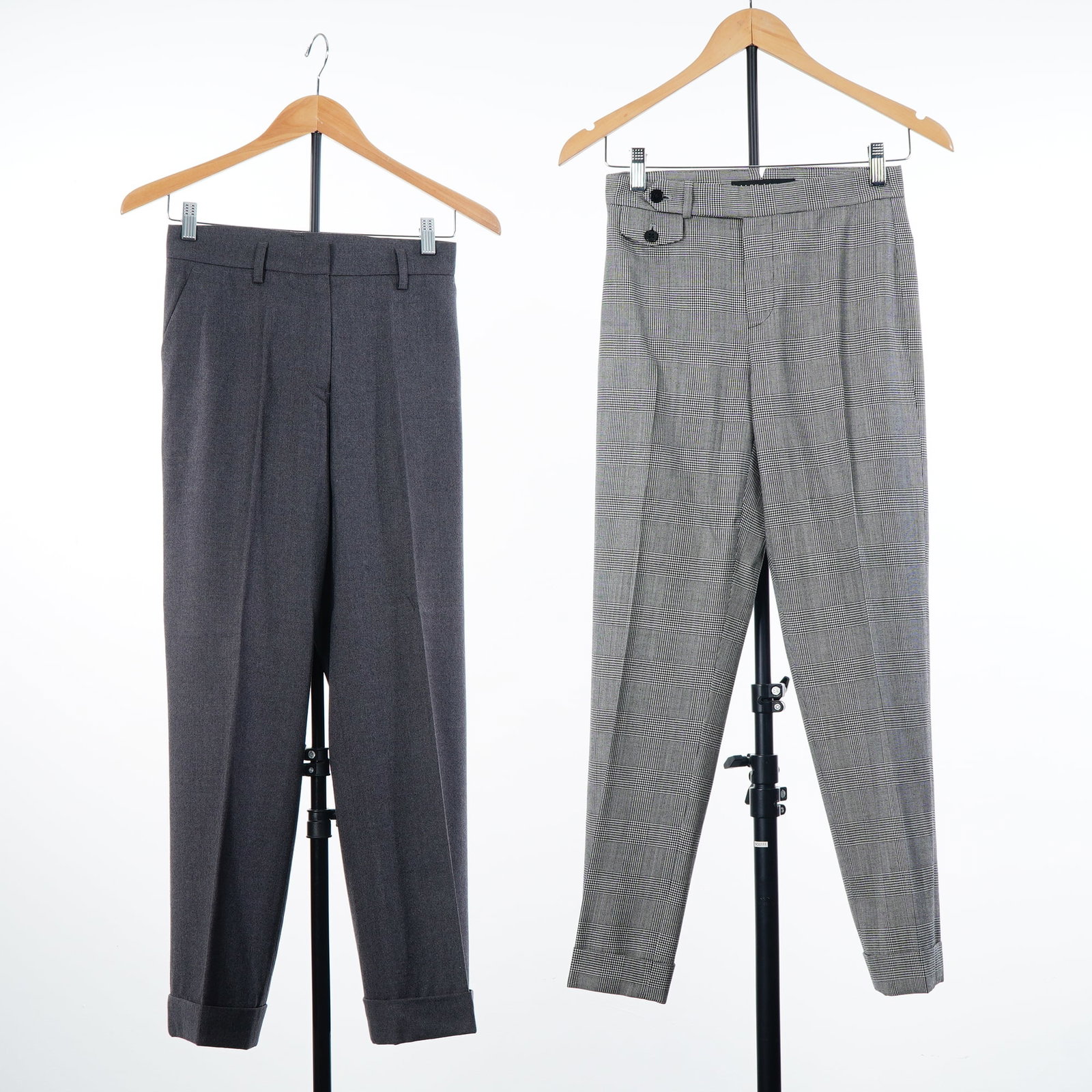 2pc Women's Designer Wool Trousers, Jil Sander and Ralph Lauren: This lot consists of two pairs of women's tailored trousers. The first pair is by Jil Sander, size 38, featuring a flat-front design in charcoal gray wool or wool-blend flannel. The garment is constru