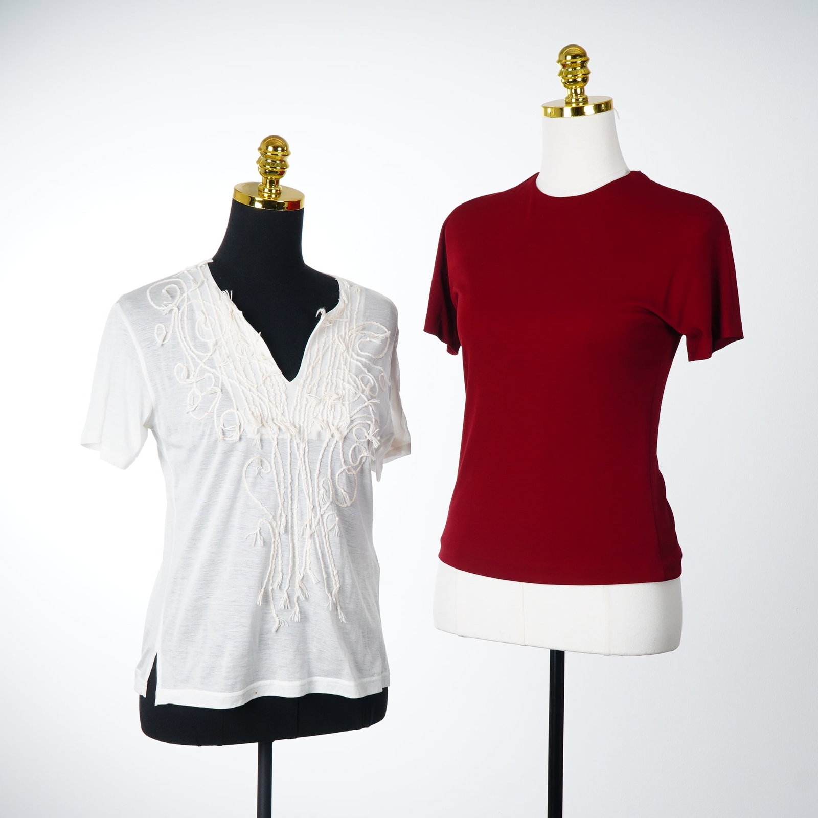 Two Women's Shirts Including Linda Baday and Heart Haat: A lot consisting of two women's shirts. The first item is a red Linda Baday shirt, size S, featuring a solid burgundy color. The garment is constructed from a knit blend of 72 percent rayon and 28 per