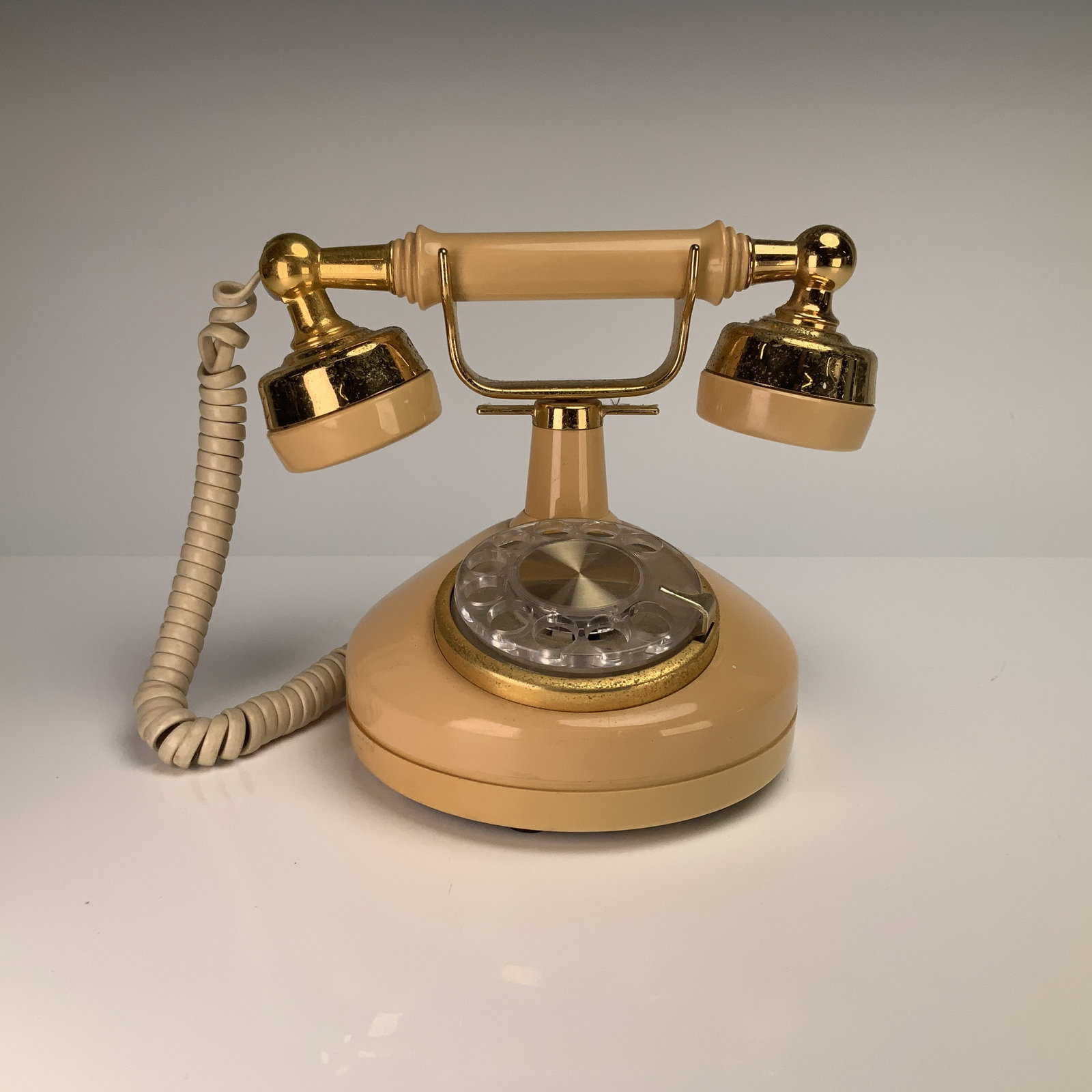 Western Electric French Style Rotary Dial Princess Telephone: This Western Electric model rotary dial princess telephone is part of the Bell System Design Line series. The unit features a cream-colored plastic housing with gold-tone plated metal components and a