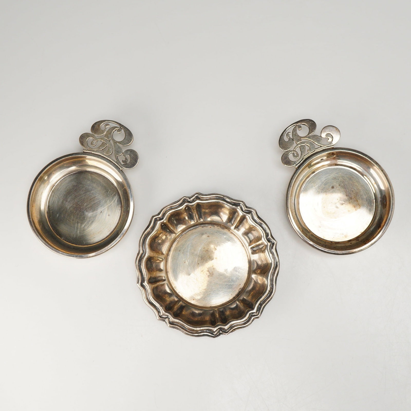 Set of 4 Sterling Silver Nut Dishes by Sanborns and Camusso: This set of four sterling silver nut dishes features examples from renowned Latin American silversmiths Sanborns and Camusso. The collection includes porringer-style dishes by Sanborns of Mexico