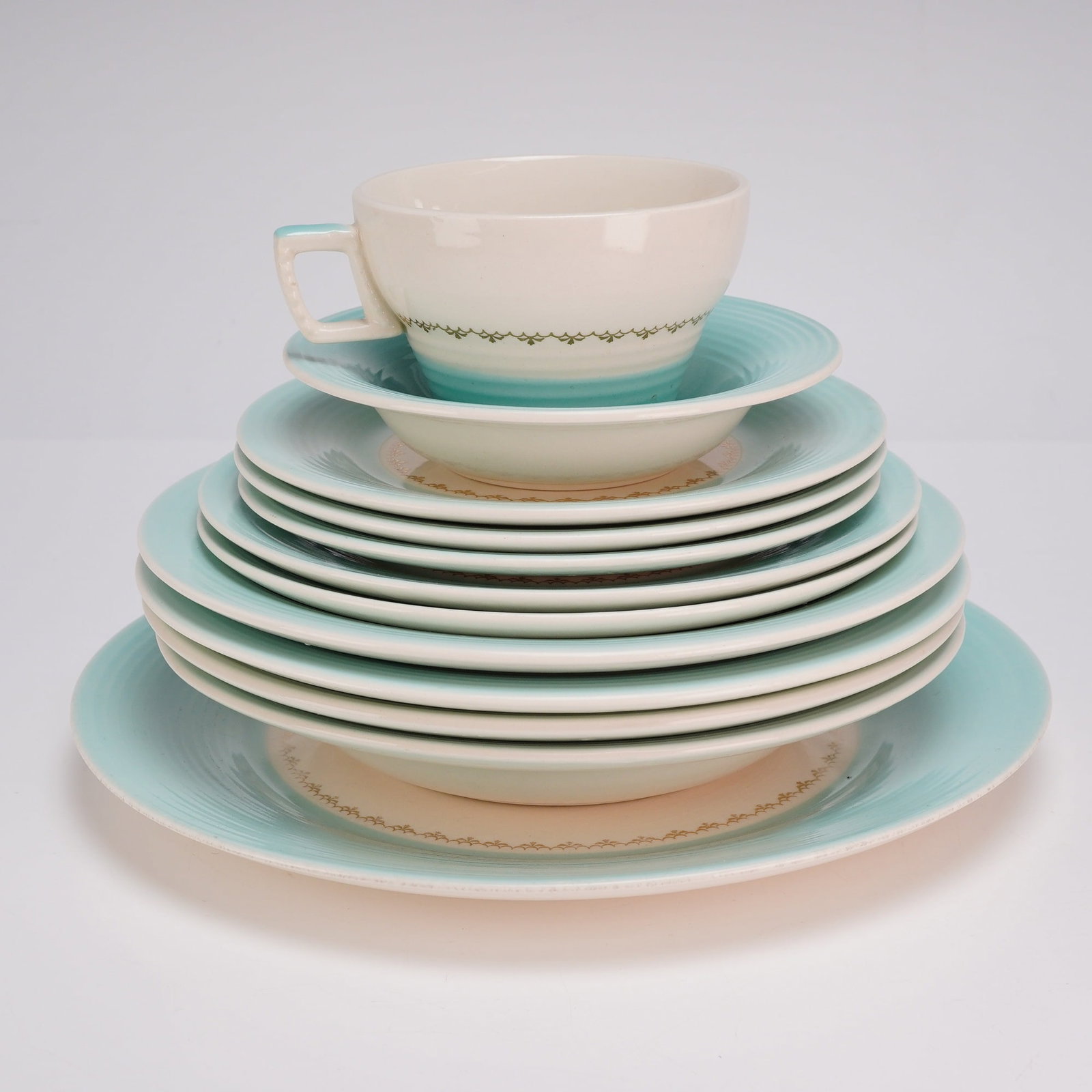 12pc American Limoges China Co. Empress Mist Cotillion Blue Flower Dinnerware: This collection of twelve American semi-vitreous ceramic dinnerware was produced by the Limoges China Company of Sebring, Ohio. The pieces are designed in the Empress shape, which features a mid-centu