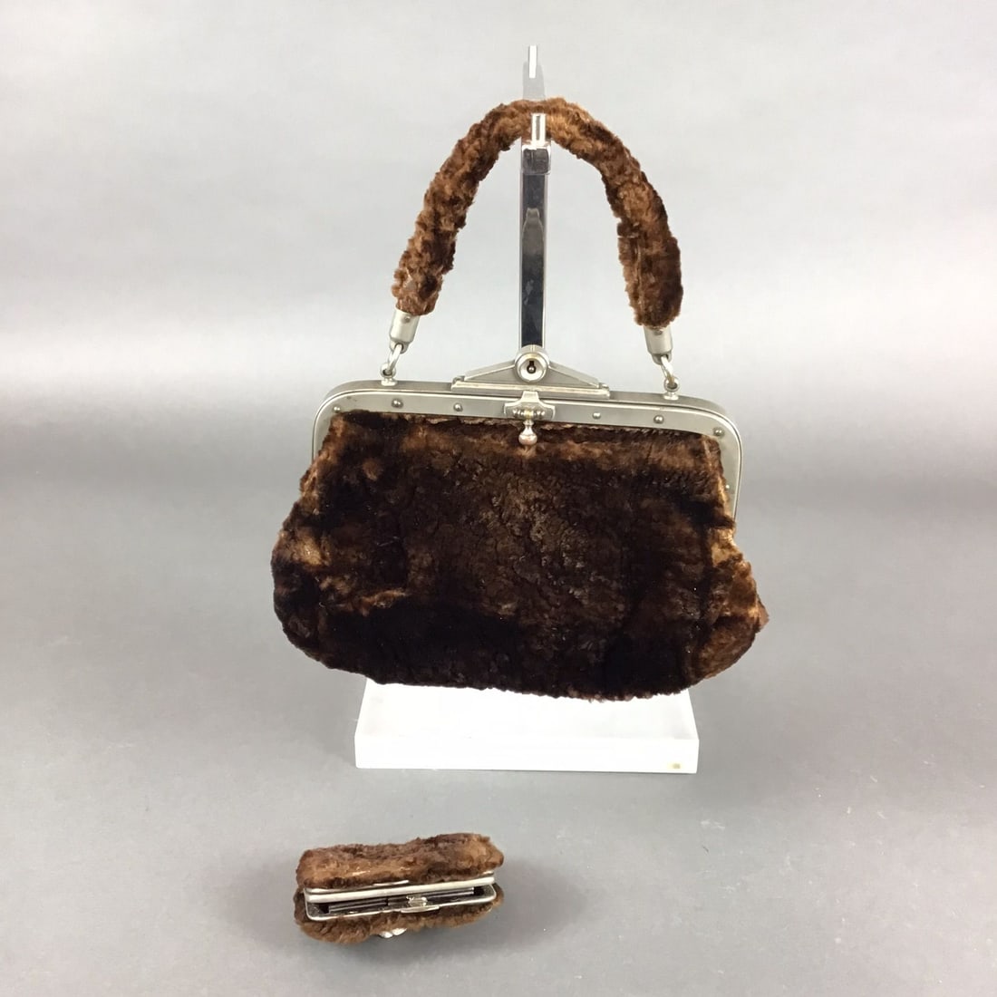 Victorian Beaver Fur Purse with Matching Coin Bag: This lot features a Victorian-era handbag and matching coin purse crafted from chocolate brown beaver fur. The main handbag is designed as a top-handle frame bag with a short-pile fur exterior and a m