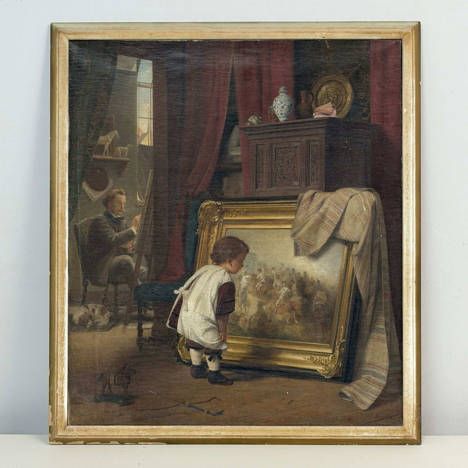 August Friedrich Siegert (German, 1820-1883) Oil on Canvas, The Little Art Lover, Signed: This oil on canvas interior genre scene, titled The Little Art Lover, is by German painter of the Dusseldorf School, August Friedrich Siegert. The composition depicts a young child in a white smock in