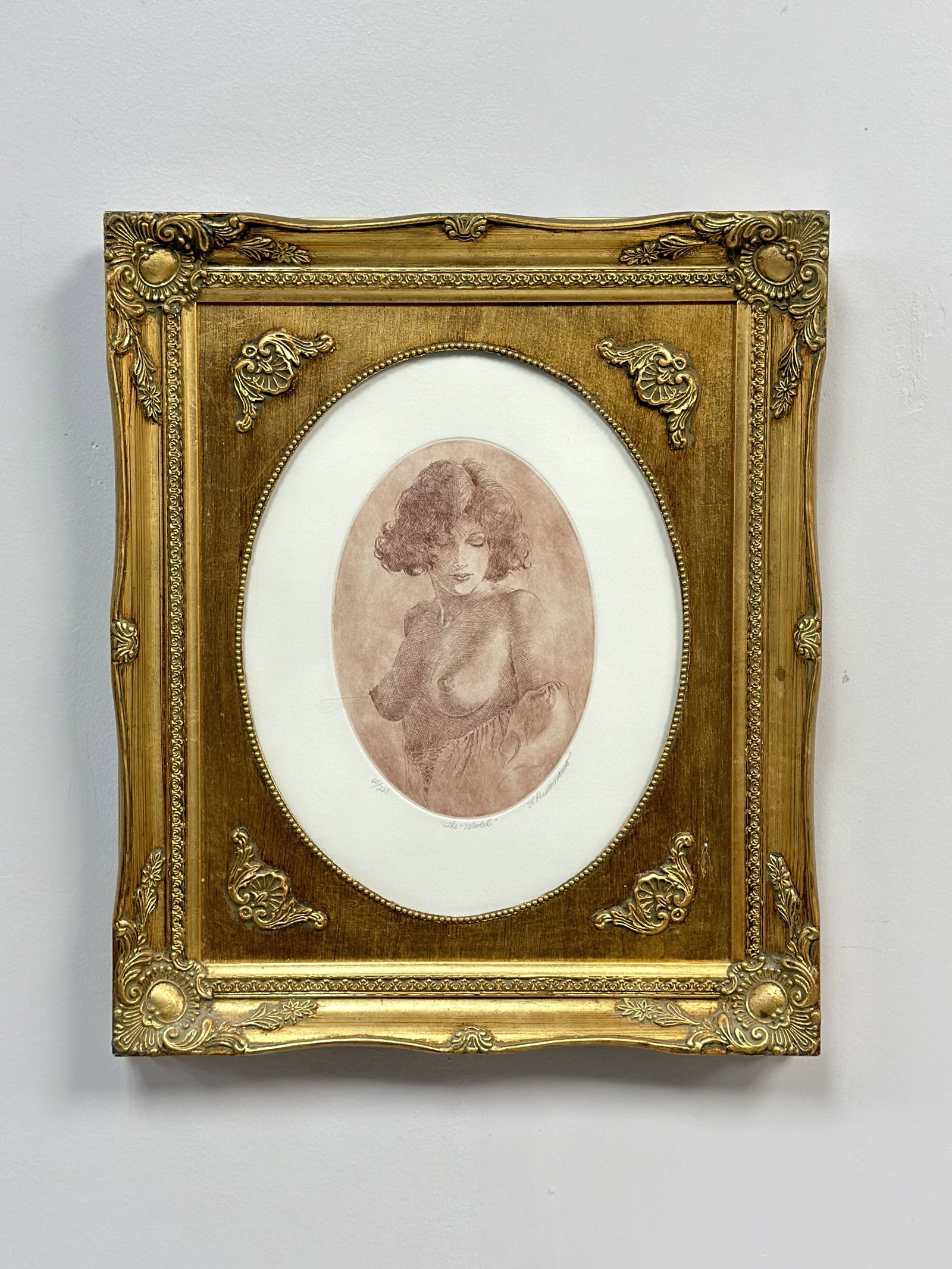 Louis Russomanno, The Model, Etching on Paper: This intaglio print by Louis Russomanno (American, 20th-21st century) is an etching on paper executed in sanguine ink. The work features a bust-length portrait of a semi-nude woman with bobbed hair, c