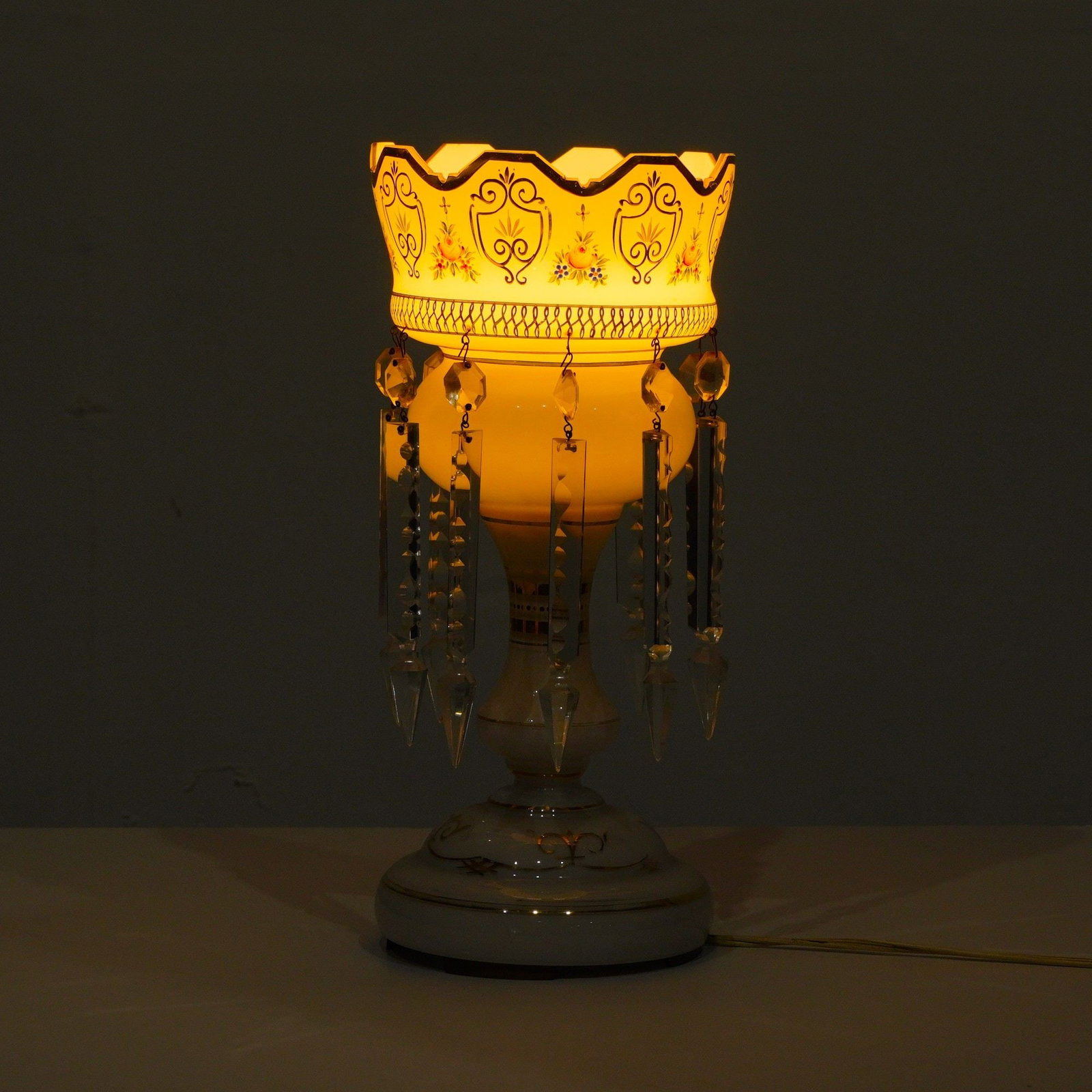 Continental Victorian Style Hand-Painted Milk Glass Mantel Luster Lamp: This table lamp is a Victorian style mantel luster converted for electrical use, likely of Bohemian or Continental origin. The lamp is crafted from white milk glass featuring an upper Vandyke