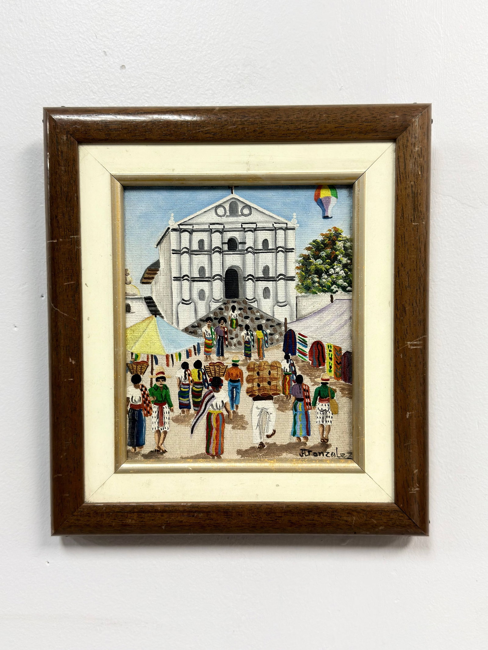 Jose Antonio Gonzalez Escobar (Guatemala, b. 1941), Market Scene Before a Church, Acrylic on Canvas: This original acrylic painting on canvas by Guatemalan artist Jose Antonio Gonzalez Escobar (b. 1941) depicts a bustling market scene set against the backdrop of a white colonial-style church, likely 