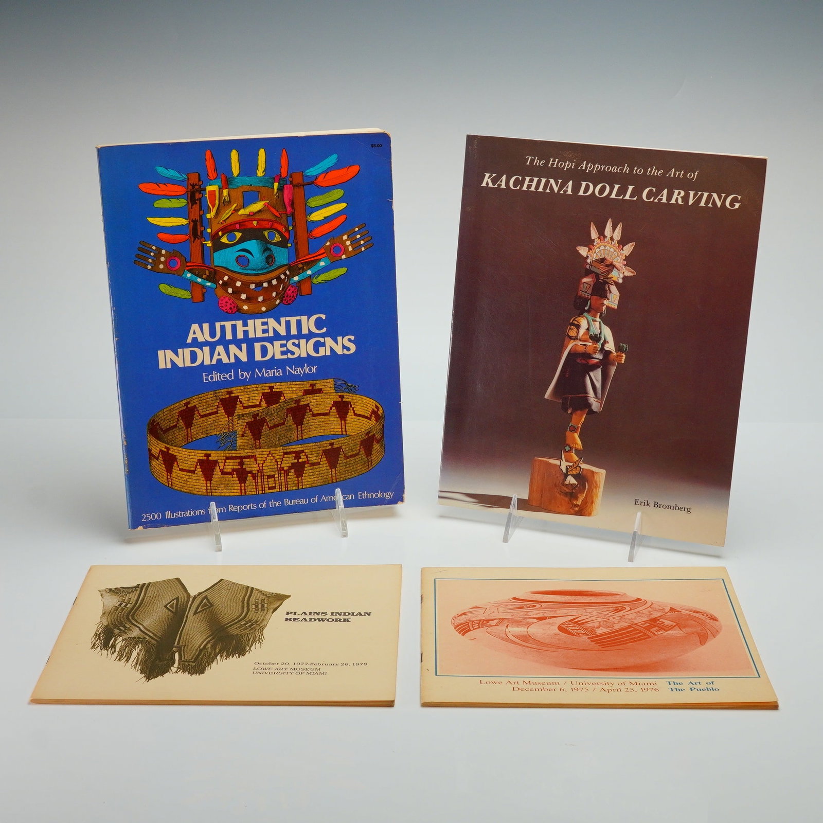 4 Publications on Native American Art and Ethnology: A collection of softcover books and exhibition catalogs focusing on Native American art, crafts, and ethnology from the mid-to-late 20th century. The group includes Authentic Indian Designs edited by 