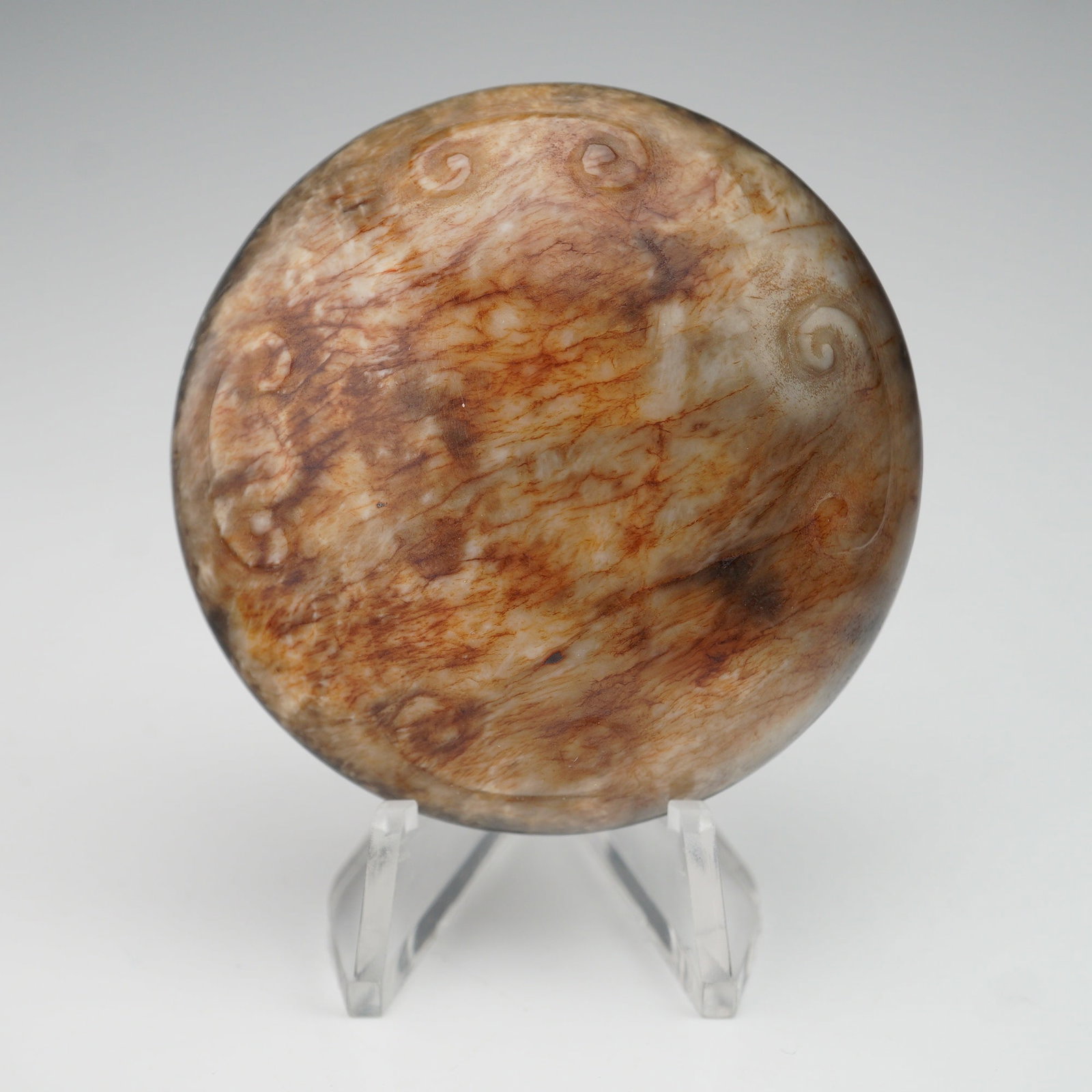 Large Chinese Ming Nephrite Jade Button: Ming dynasty jade large button featuring a domed surface adorned with finely carved Ruyi motif patterns. The reverse displays a precisely incised yin-yang design, demonstrating balance and harmony. Cr