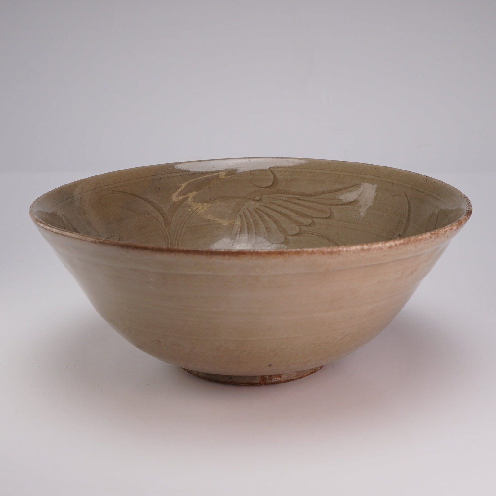 Chinese Celadon Glazed Bowl, Incised Floral Design, Song Dynasty: A Chinese celadon glazed bowl with a pale green color, decorated with an incised floral design in the interior. Dimensions 7.25"W x 3"H Weight 1.80 lb