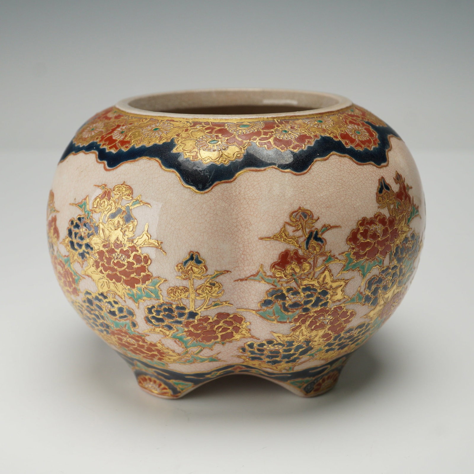 Japanese Satsuma Floral Gosu Blue Jar: Japanese Satsuma stoneware lobed jar decorated with intricate floral motifs in red, green, and blue enamel with extensive gilt detailing. The design features richly ornamented flowers in a continuous 
