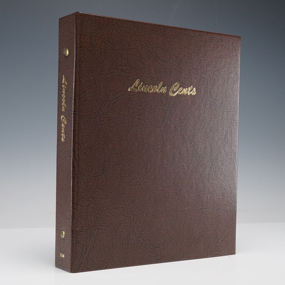 1909-2015 Lincoln Cent Coin Album: A Lincoln cent collection housed in a brown coin album, spanning dates from 1909 through 2015. The album contains a partial set of coins representing over a century of U.S. cent production, including 
