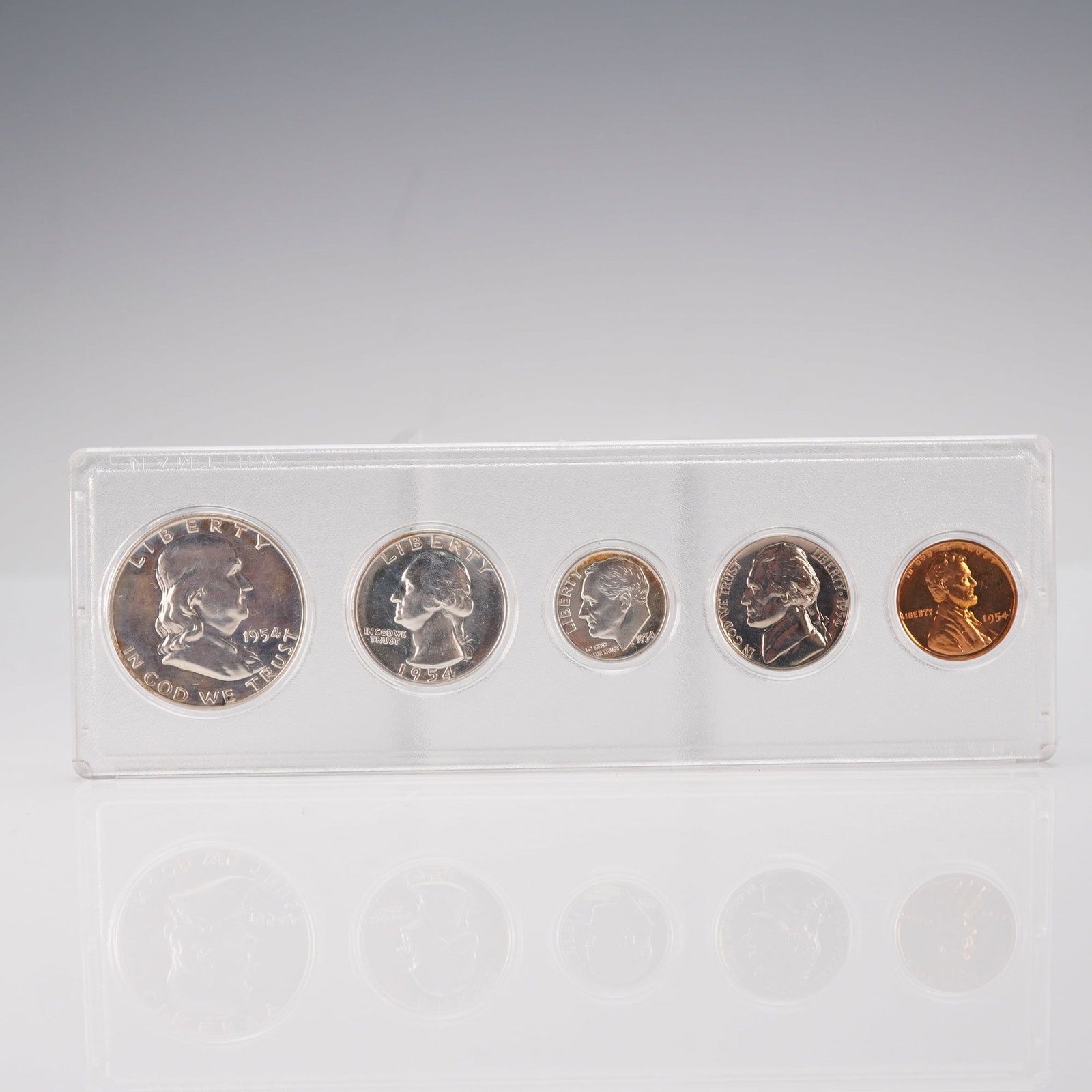 US 1954 5-Coin Set: A complete 1954 US Coin Set issued by the United States Mint. This collection of 5 coins includes the Franklin Half Dollar, Washington Quarter, Roosevelt Dime, Jefferson Nickel, and Lincoln Cent. Desi
