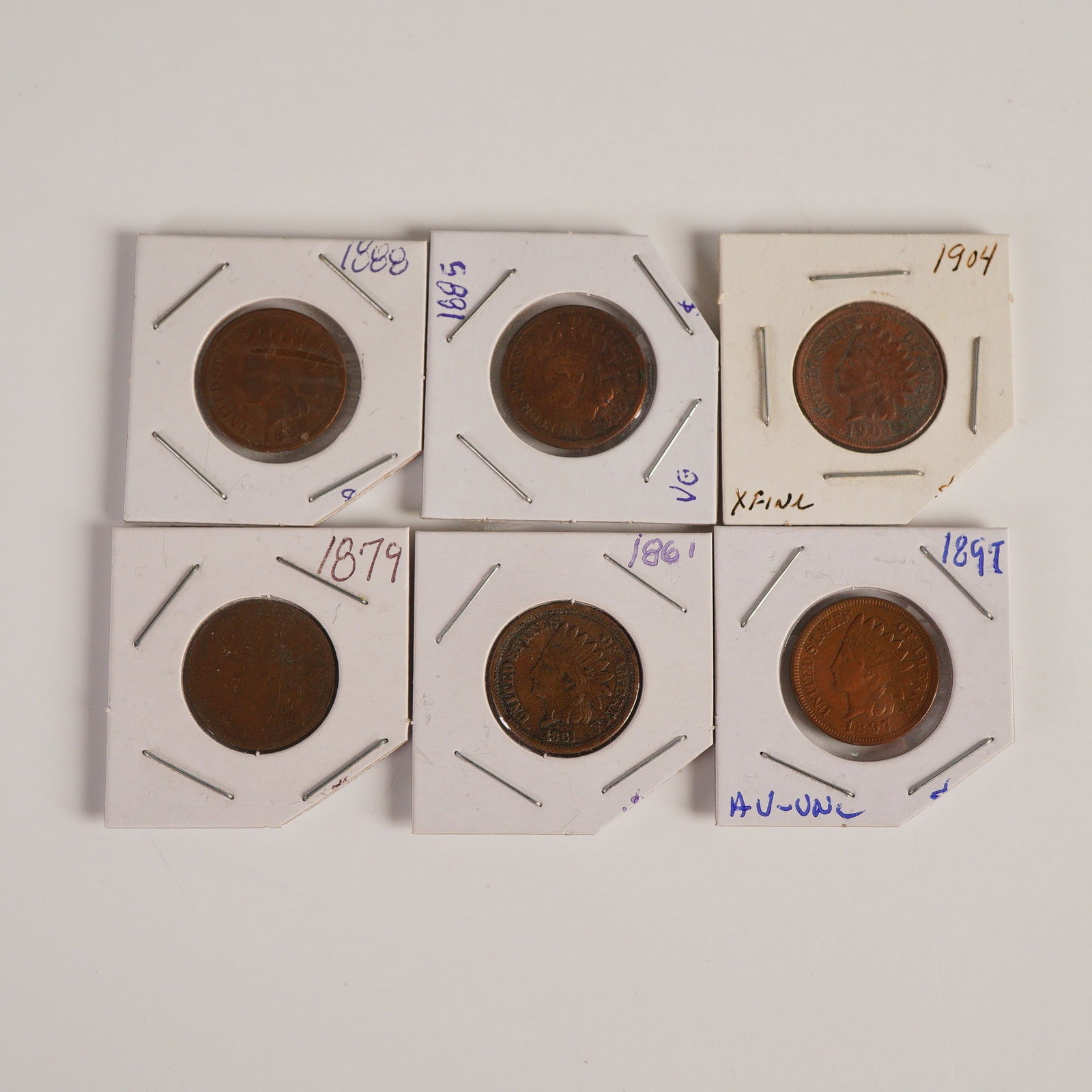 6pc 1861 to 1904 Indian Head 1 Cent Coins: Struck in a bronze alloy containing approximately 95 percent copper and 5 percent tin and zinc with a weight of 3.11 grams; the obverse design features a left-facing Liberty wearing a feathered headdr