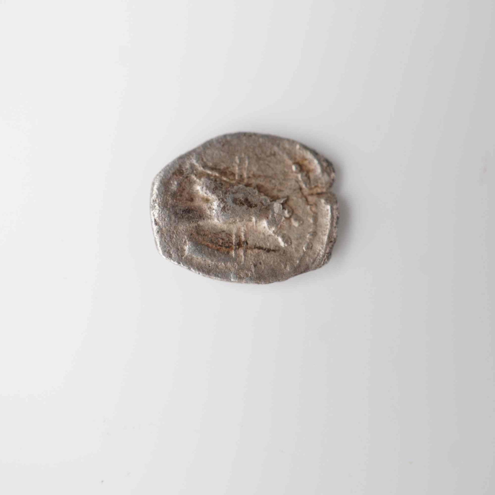 Ancient Phoenicia Tyre Silver 1/16 Shekel: Ancient silver fractional coin issued in Tyre (Lebanon), Phoenicia, circa 450-400 B.C. The obverse depicts a dolphin swimming left within a cable border. The reverse features a horned owl standing lef