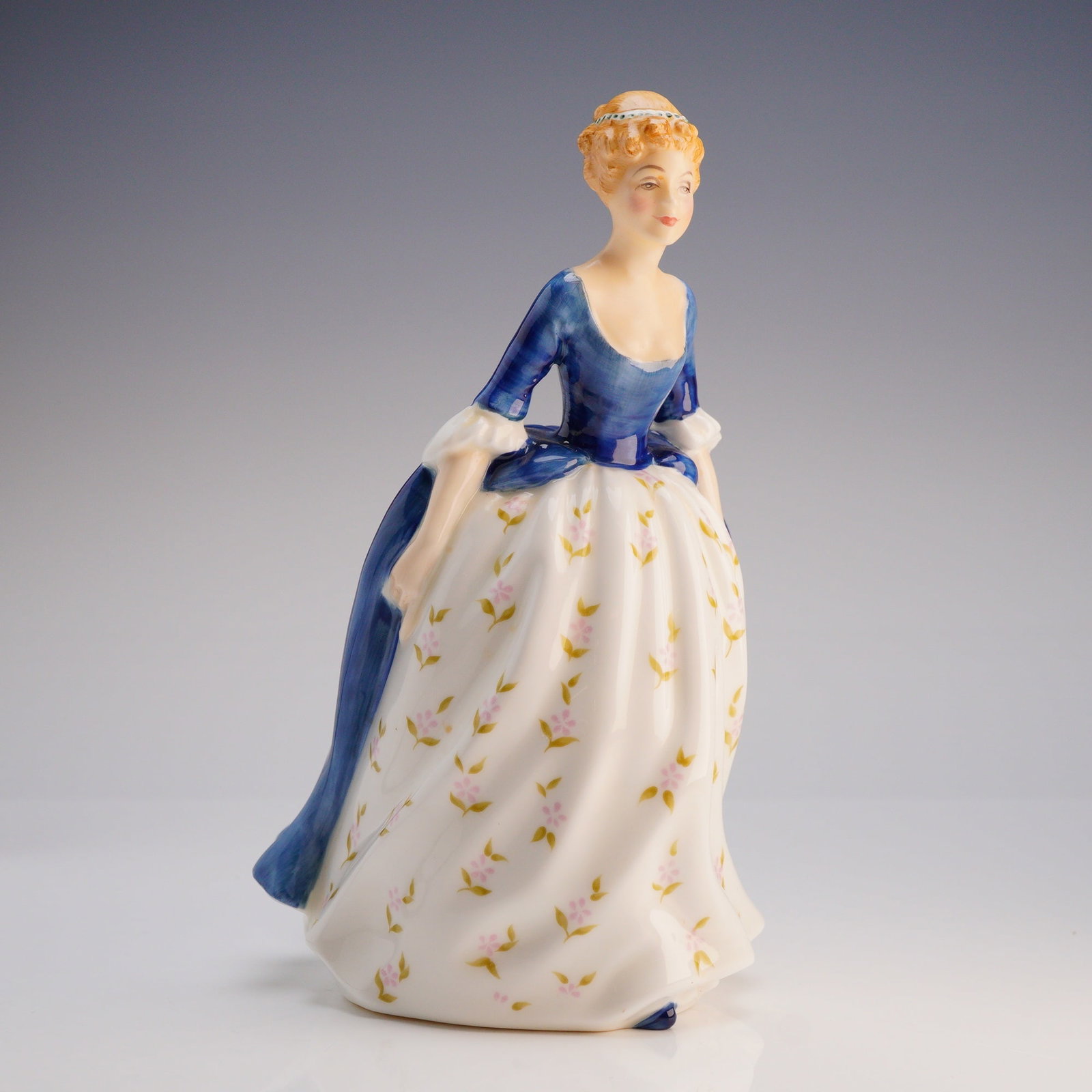 Royal Doulton Figurine Alison HN2336: A single Bone China figurine, "Alison," model number HN2336, manufactured by Royal Doulton, England, dating to the post-war period with a copyright date of 1965. The figure is depicted in historical s