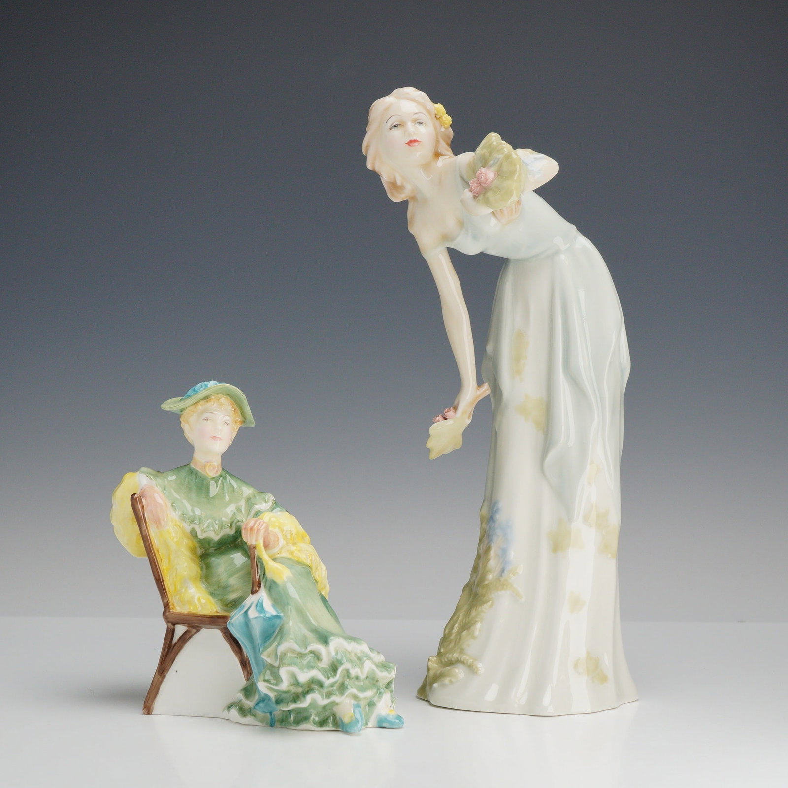 Two Royal Doulton Porcelain Figurines, Ascot HN2356 and Summer's Darling HN3091: This lot consists of two Royal Doulton glazed bone china figurines. The first figurine is titled Summer's Darling from the Reflections series, model number HN 3091. It features a stylized, slender wom