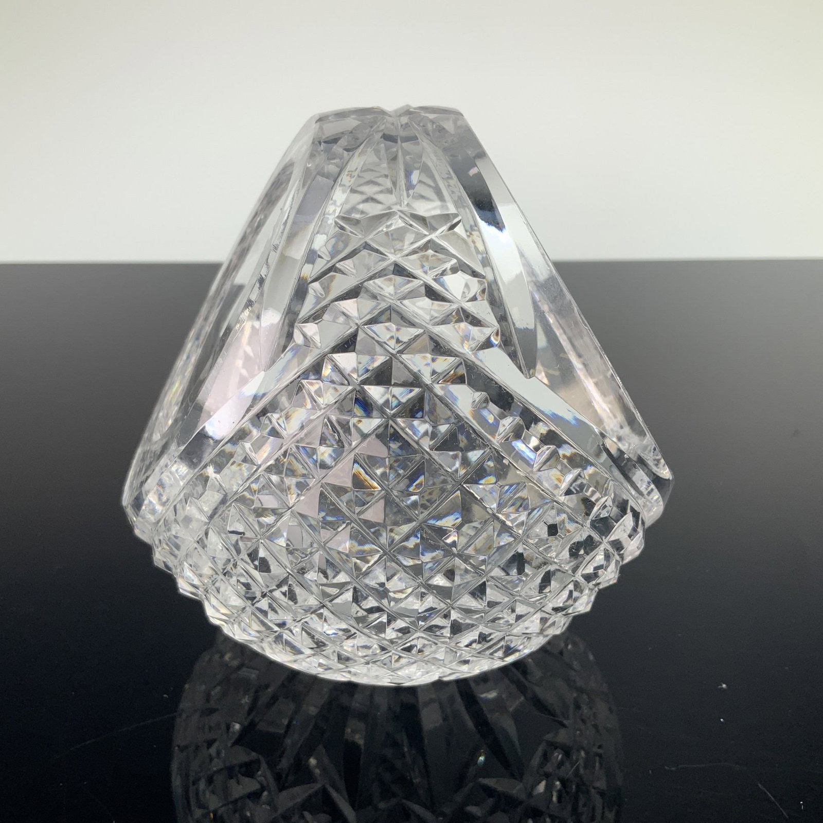 Waterford Crystal Round Handled Basket, Glandore: This Waterford crystal round basket is executed in the Glandore pattern, featuring a globular form with an integrated bridge handle. The piece is crafted from heavy lead crystal with deep, hand-cut or