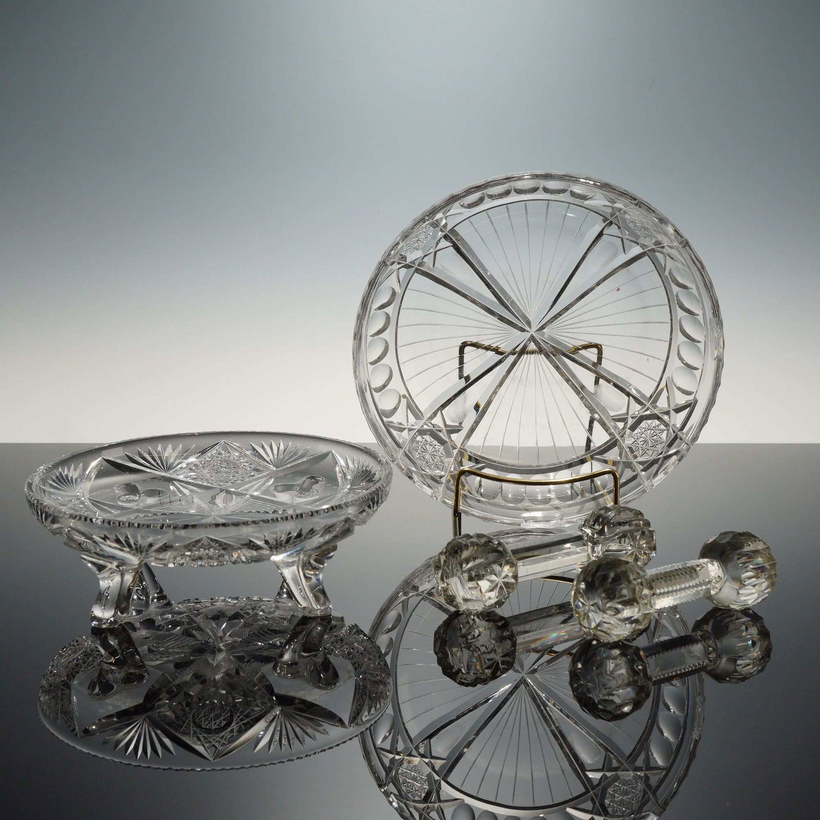 Four Pieces of American Brilliant Period Style Clear Cut Glass - Bowls and Knife Rest: This group of four clear glass items is executed in the American Brilliant Period style, characteristic of high-lead crystal produced between 1876 and 1917. The collection includes a shallow four-foot