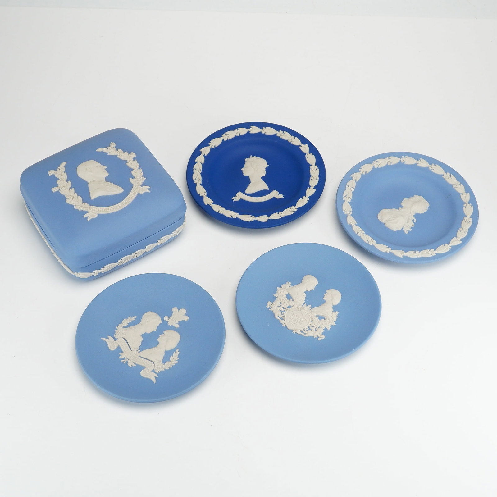 5pc Collection of Wedgwood Jasperware British Royal Commemorative Blue Wedge Items: This collection of unglazed matte stoneware, known as jasperware, was produced by the Wedgwood factory in England. The group includes several pieces of blue jasperware featuring white sprigged bas-rel