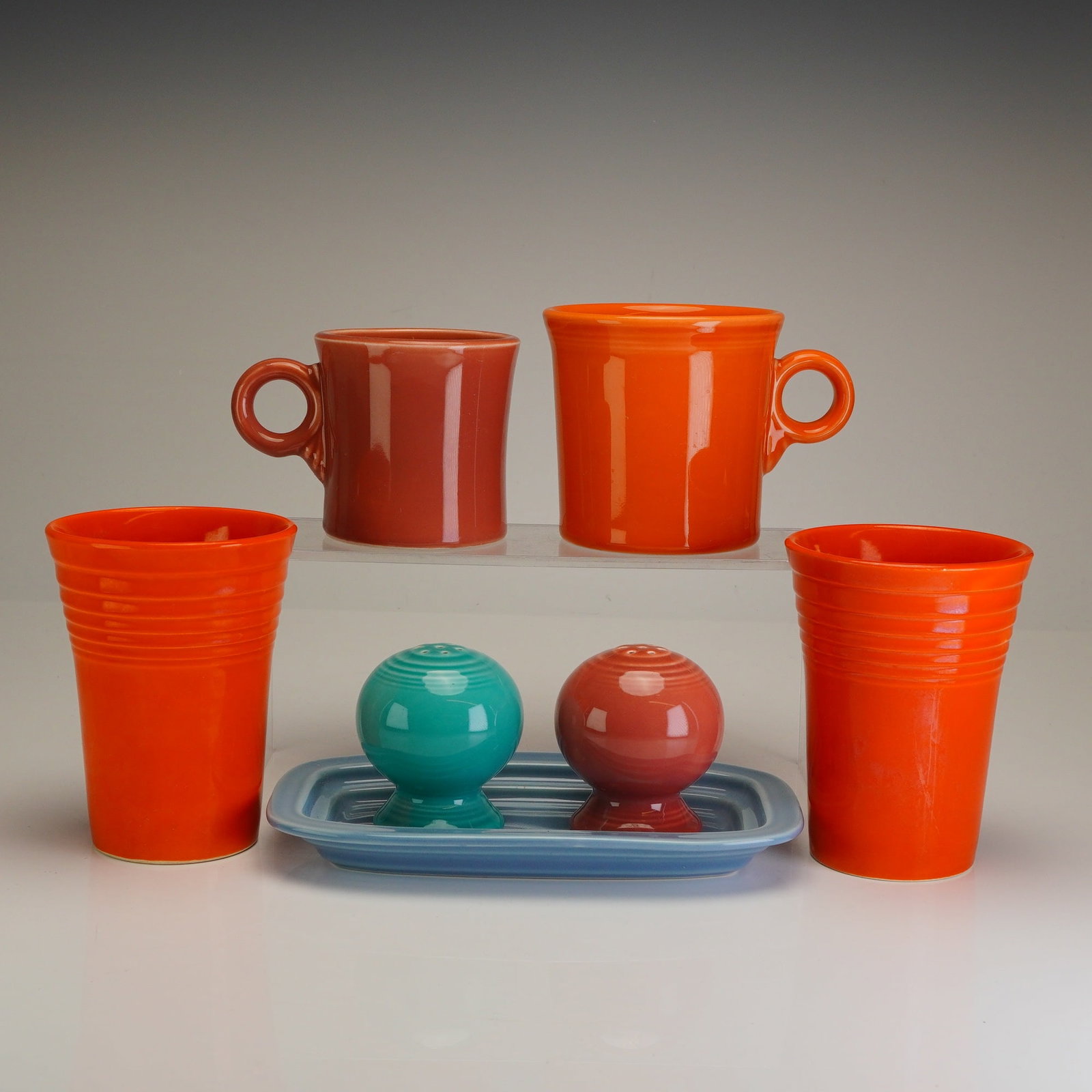 A Seven Piece Collection of Homer Laughlin Fiestaware Ceramic Tablewares: A collection of seven ceramic tablewares produced by the Homer Laughlin China Co. of Newell, West Virginia. This group features the iconic Art Deco-inspired concentric ring pattern and solid-colored g
