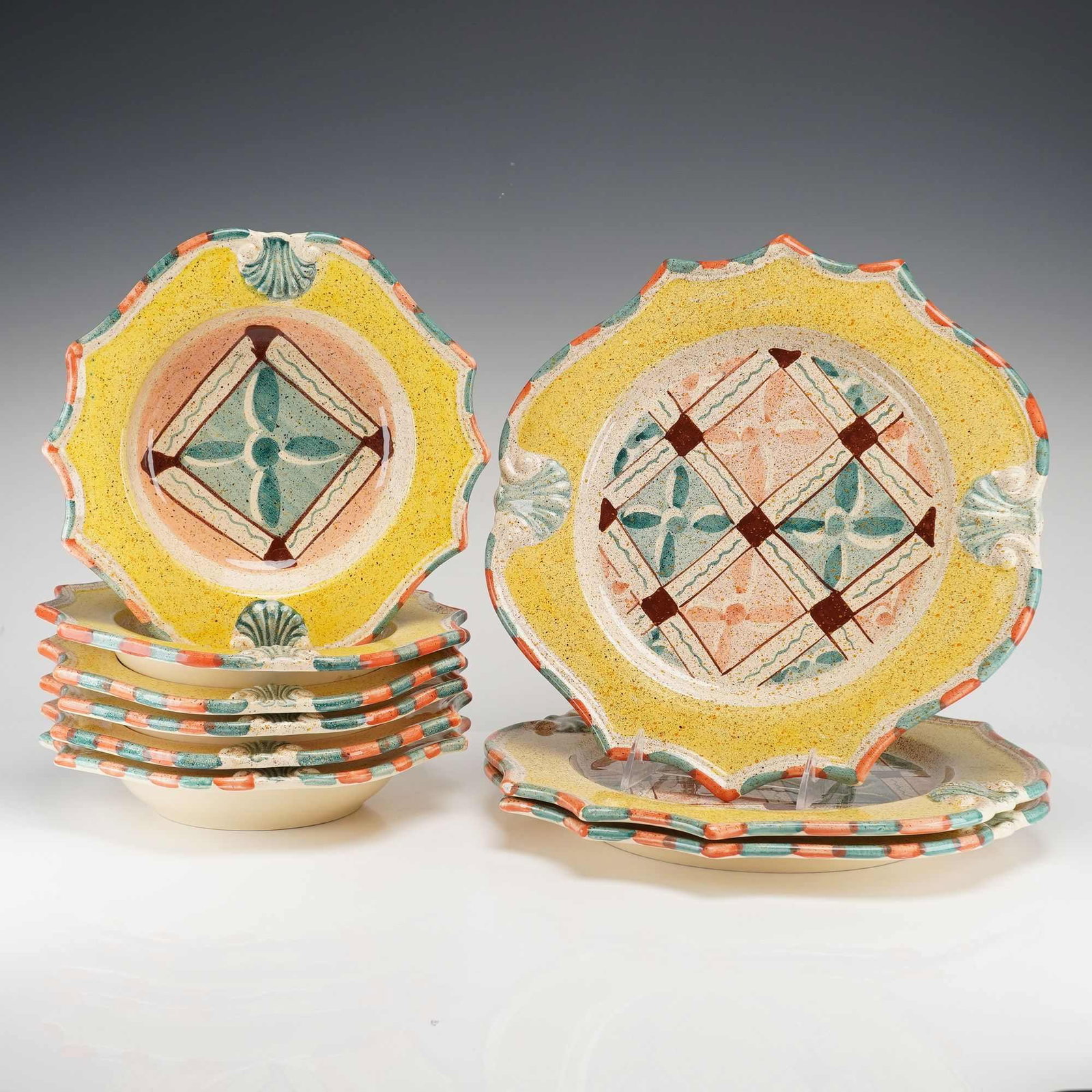 Set of Nine Medici Pattern Italian Ceramic Dinnerware- Plates and Bowls: This set of hand-painted earthenware dishes in the Medici pattern was manufactured in Italy and imported for the American market, specifically for retailers such as Horchow and Neiman Marcus. The coll