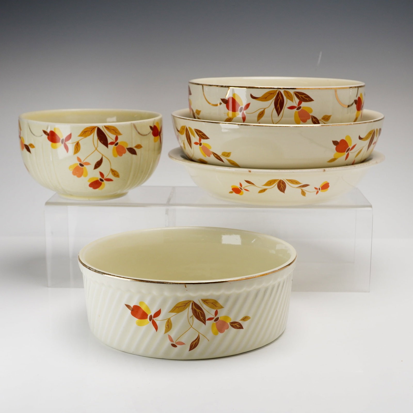 Set of Five Hall Superior China Ceramic Bowls, Autumn Leaf: This set of five ceramic bowls is manufactured by the Hall China Company in the Autumn Leaf pattern, which was produced as a premium for the Jewel Tea Company. The pieces are constructed from cream-co