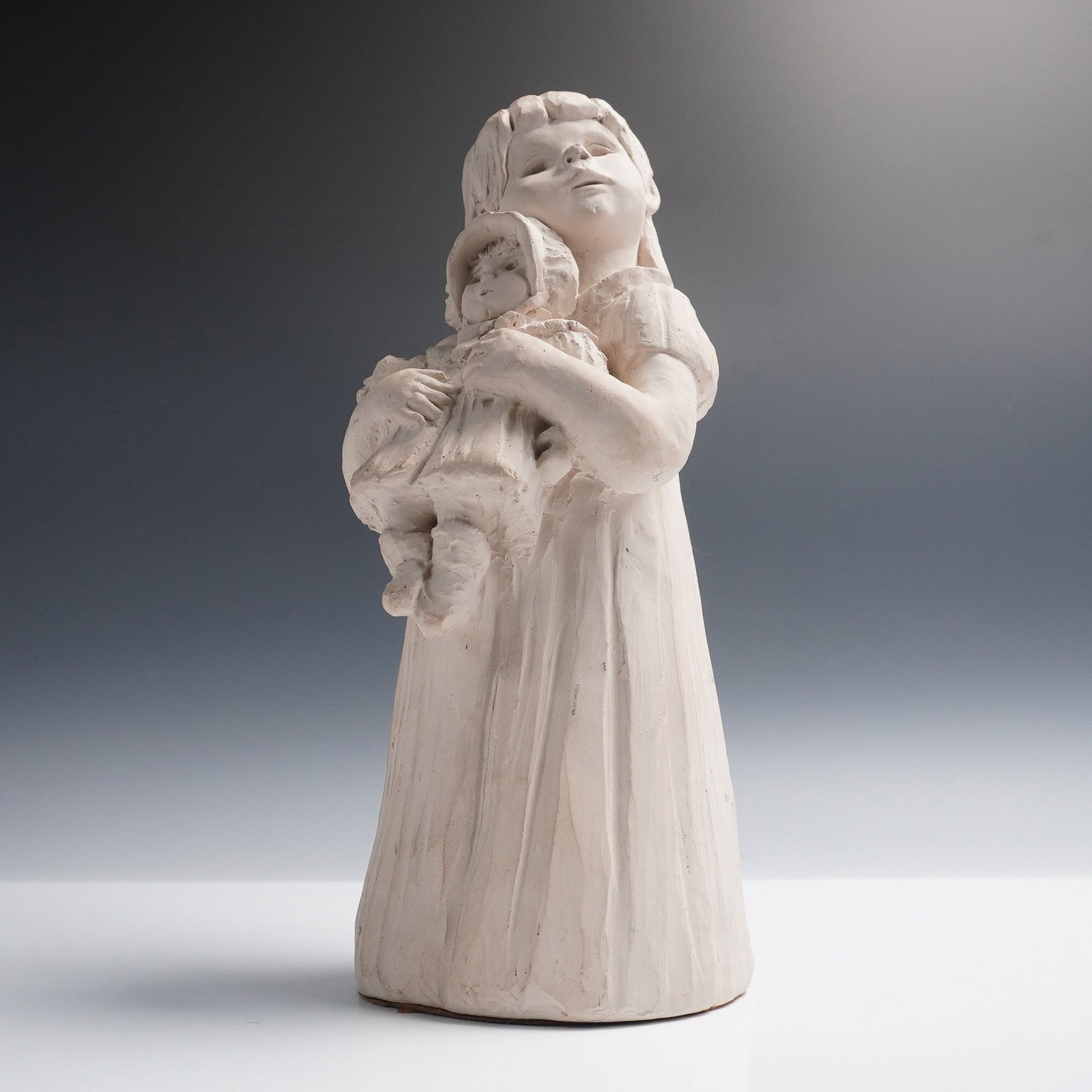 Austin Sculpture, My Dolly by Dee Crowley, 1985: Figurative sculpture titled My Dolly for the Bright Eyes collection by artist Dee Crowley for Austin Productions, dated 1985. This hauntingly expressive piece features a young girl holding a doll clos