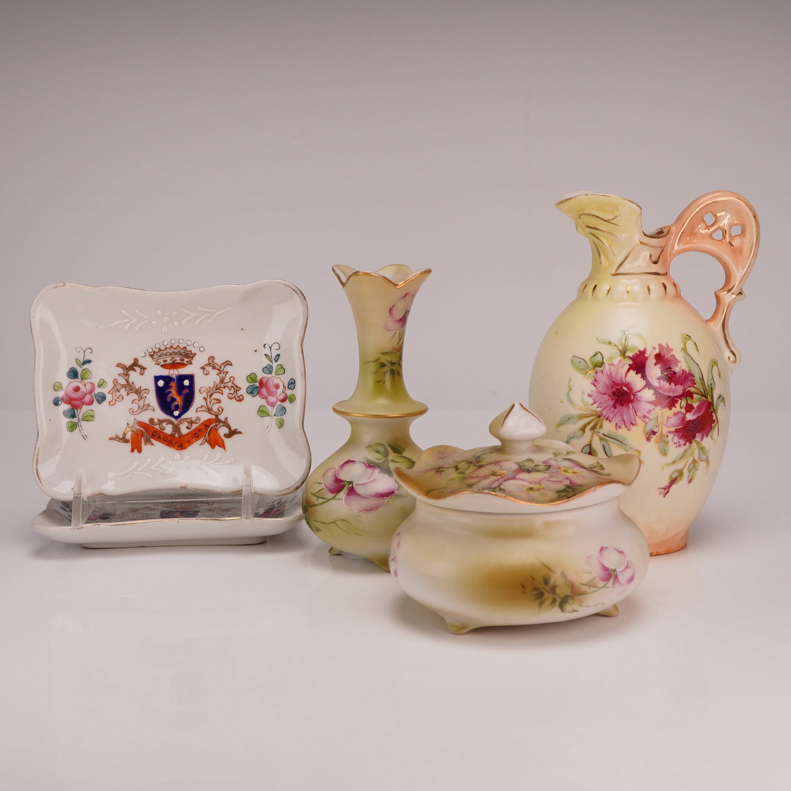 5pc Hand-Painted Porcelain Jewelry Trays, Lidded Jar and Vase, and Pitcher, Occupied Japan & Austria: This collection consists of five hand-painted porcelain pieces and includes two matching rectangular jewelry or pin trays featuring a scalloped rim and a central armorial coat of arms. The crest displ