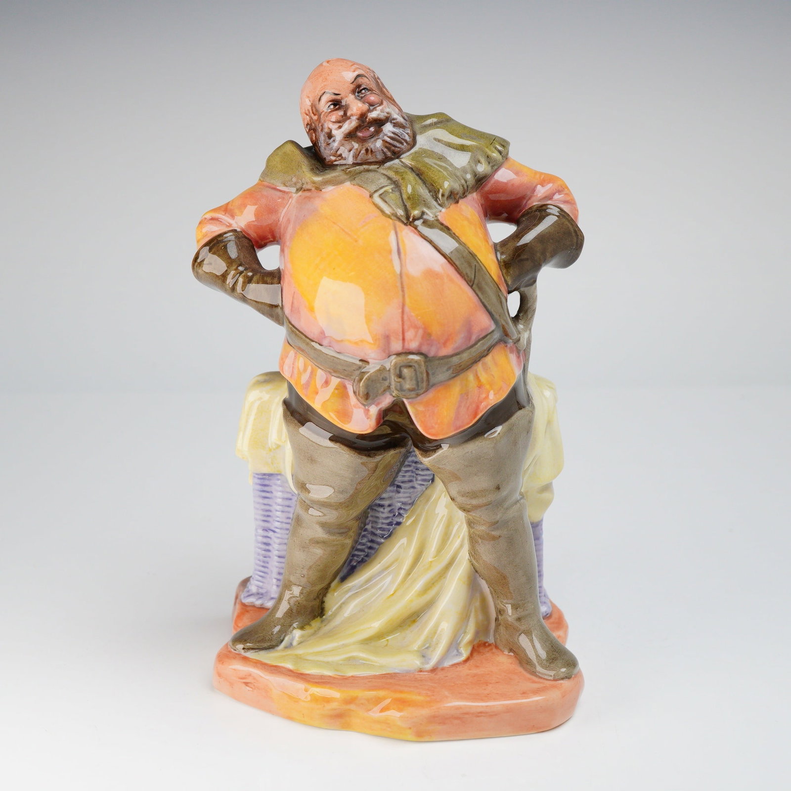 Royal Doulton Falstaff HN 2054 Ceramic Figurine: A Royal Doulton Figurine, Falstaff HN2054, depicting the character in orange, green, and brown attire, bearing the green printed marks "MADE IN ENGLAND," "ROYAL DOULTON," "Falstaff," "H.N. 2054," "COP