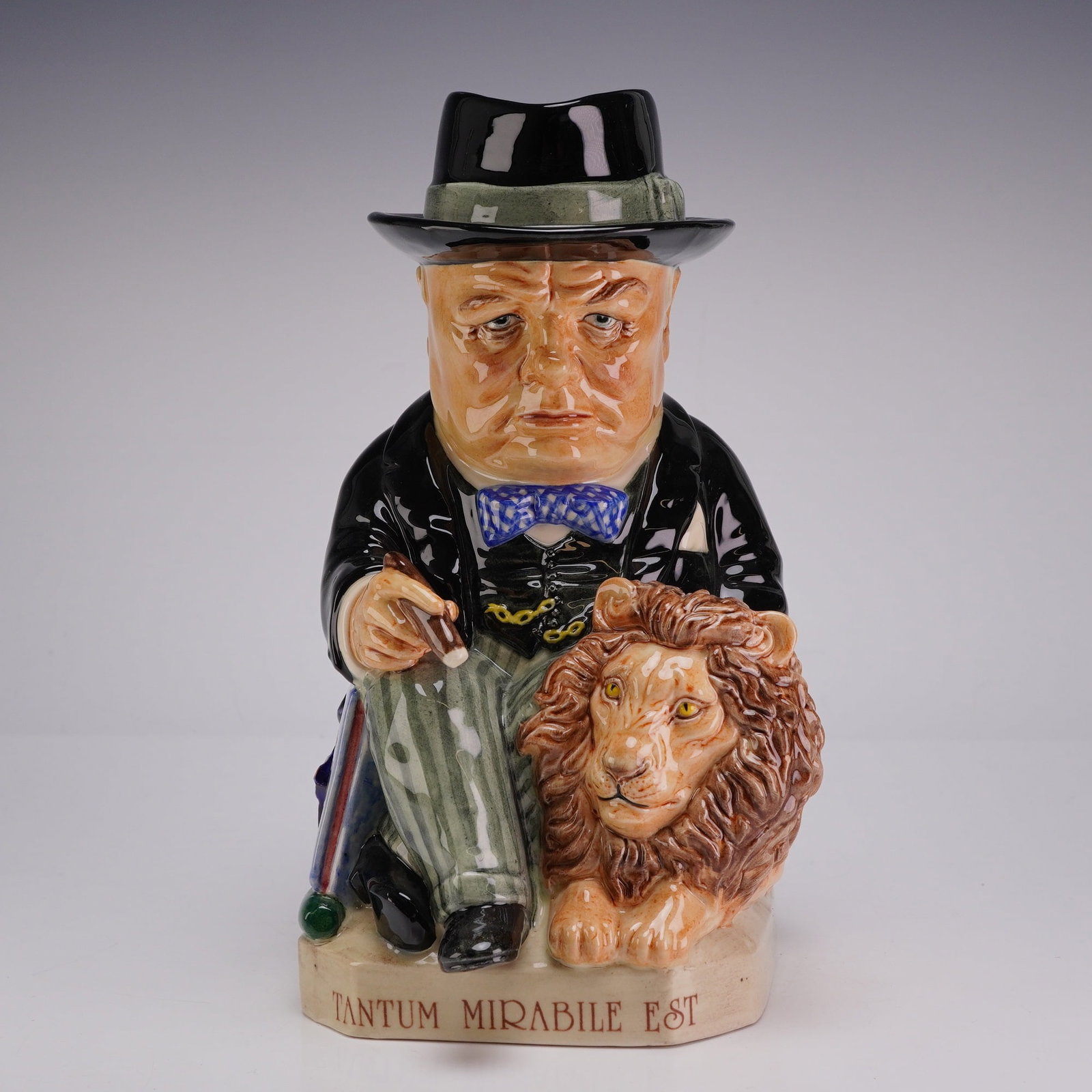 Kevin Francis Ceramics Spirit of Britain Winston Churchill Limited Edition Toby Jug: A hand-painted ceramic Toby jug from the Spirit of Britain series by Kevin Francis Ceramics, depicting Sir Winston Churchill. The figure is modeled in a seated position, wearing a black Homburg hat, a