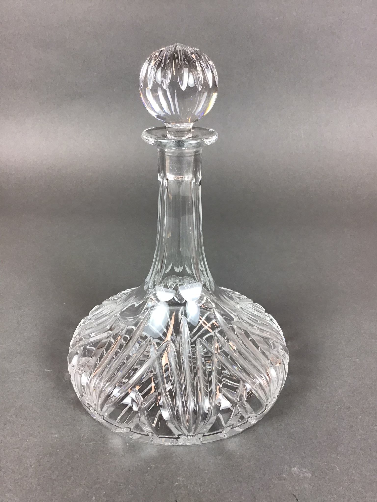 Marquis by Waterford Brookside Cut Crystal Ship's Captain Decanter with Stopper: This lead crystal ship's captain decanter is produced by Marquis by Waterford in the Brookside pattern. The vessel features a wide, weighted base designed for stability, tapering into an elongated nec