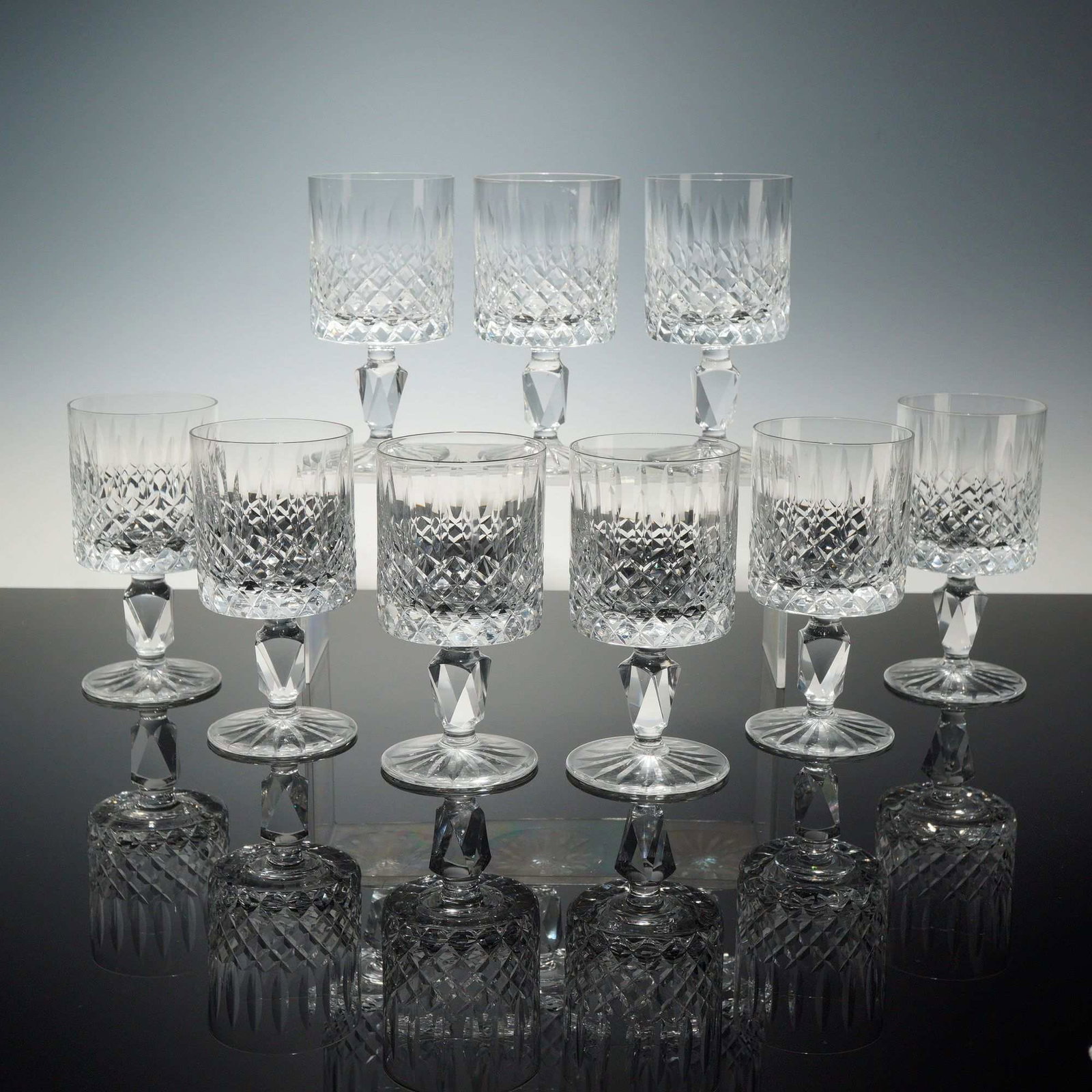 Set of Nine Waterford Crystal Wine Glasses, Lismore Simplicity: This set of nine glasses (glasses x 9) is identified as the Longchamp pattern by Cristal d Arques. The glasses are crafted from lead crystal and feature a straight-sided cylindrical bowl. The exterior