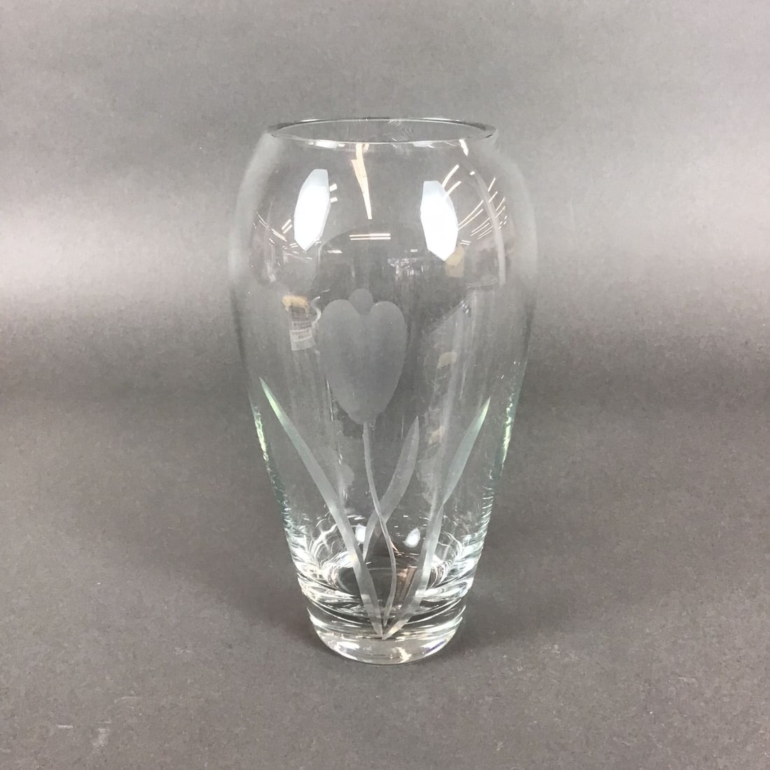 Krosno Poland Clear Crystal Etched Tulip Vase: This clear crystal etched vase is a Krosno Poland piece featuring a tulip motif. The vessel is crafted from heavy lead glass in a thick-walled ovoid form with a polished rim and a weighted base. The d
