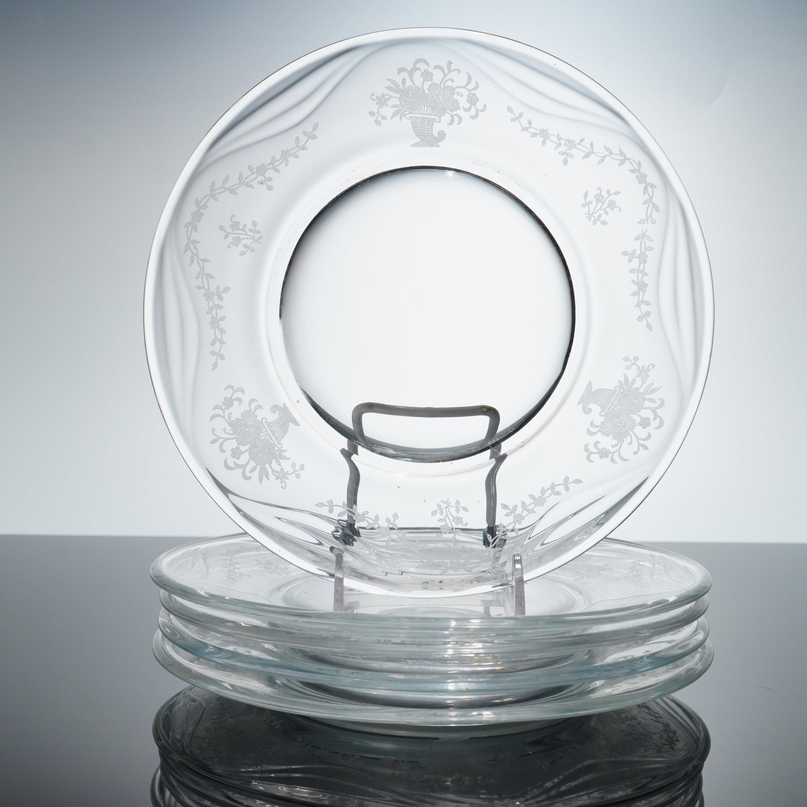 Set of Five Fostoria Etched Glass Plates, Mayflower Pattern: This set of four salad or dessert plates is identified as the Mayflower pattern produced by the Fostoria Glass Company. These etched glass plates are examples of American Elegant Glass from the mid-20