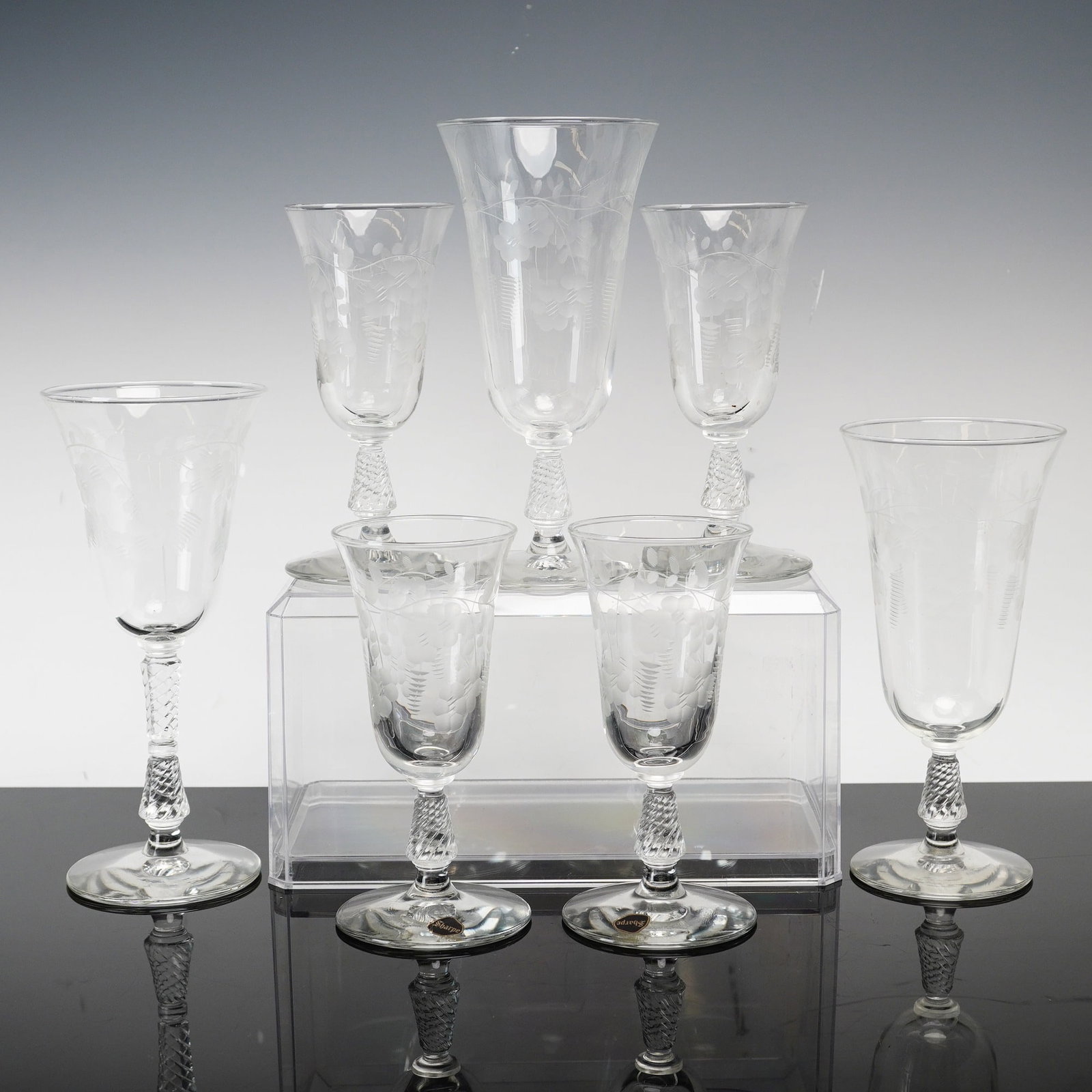 7pc Rock Sharpe Cut Crystal Stemware in Pattern #3007: This sharpe glass mixed lot consists of seven pieces of clear lead crystal stemware featuring the #3007 twisted swirl stem. The collection includes one water goblet, four wine glasses, and two iced te