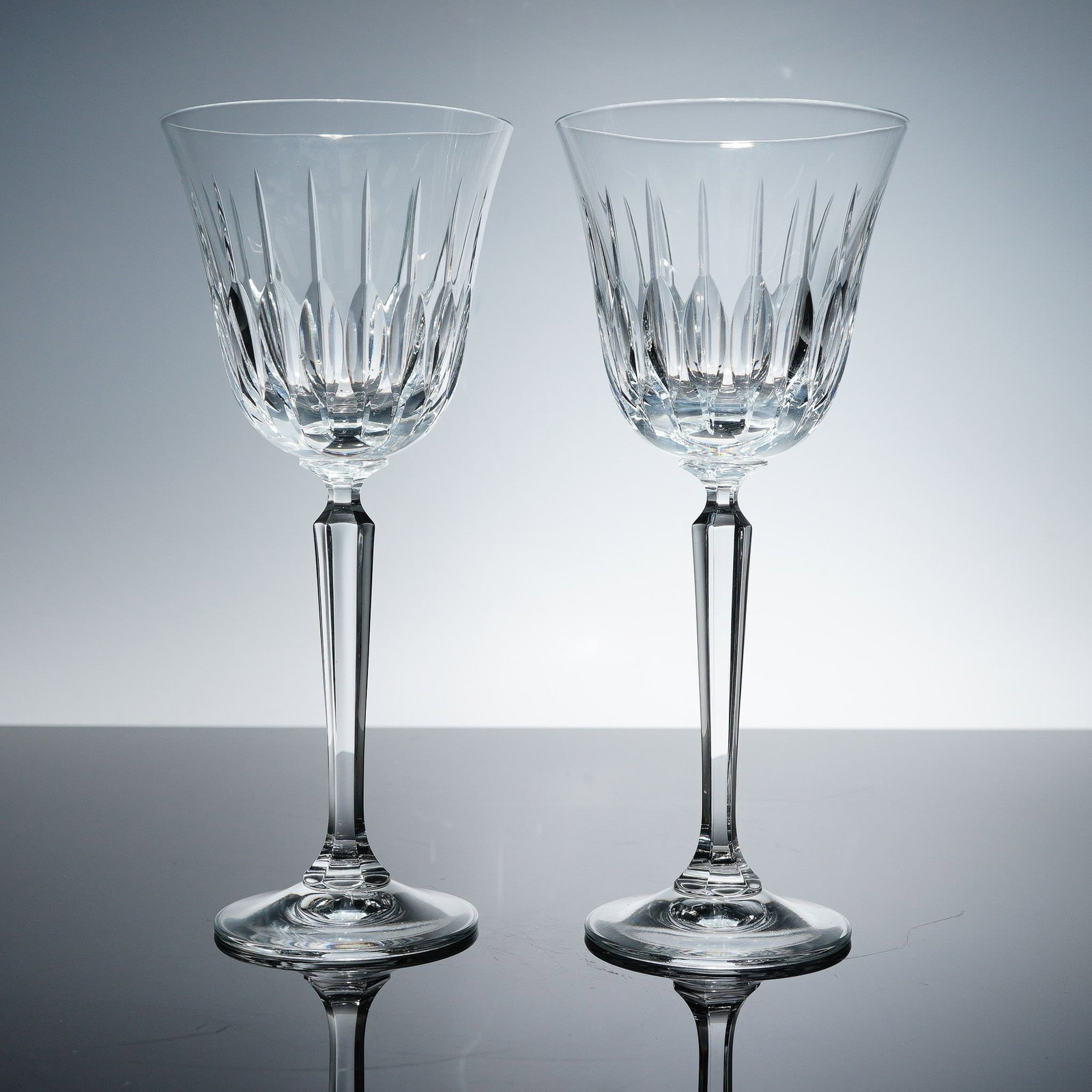 2pc Wine Glasses, Mikasa Park Avenue Pattern: These elegant Mikasa wine glasses from the Park Avenue pattern feature vertical faceted cuts that catch the light beautifully, creating a sophisticated sparkle ideal for formal dining. Crafted from