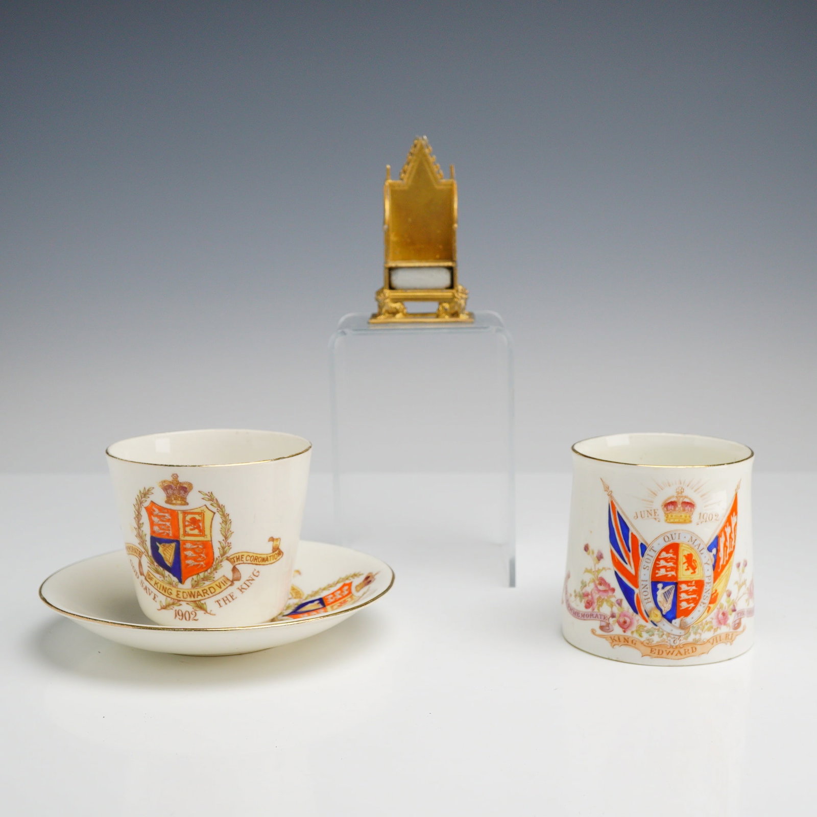 4pc King Edward 7th Reign English Royalty Coronation Commemoratives: This set of English royalty commemoratives dates to the reign of King Edward VII, specifically marking his 1902 coronation. The collection includes a porcelain mug by Aynsley and Sons, Longton, featur